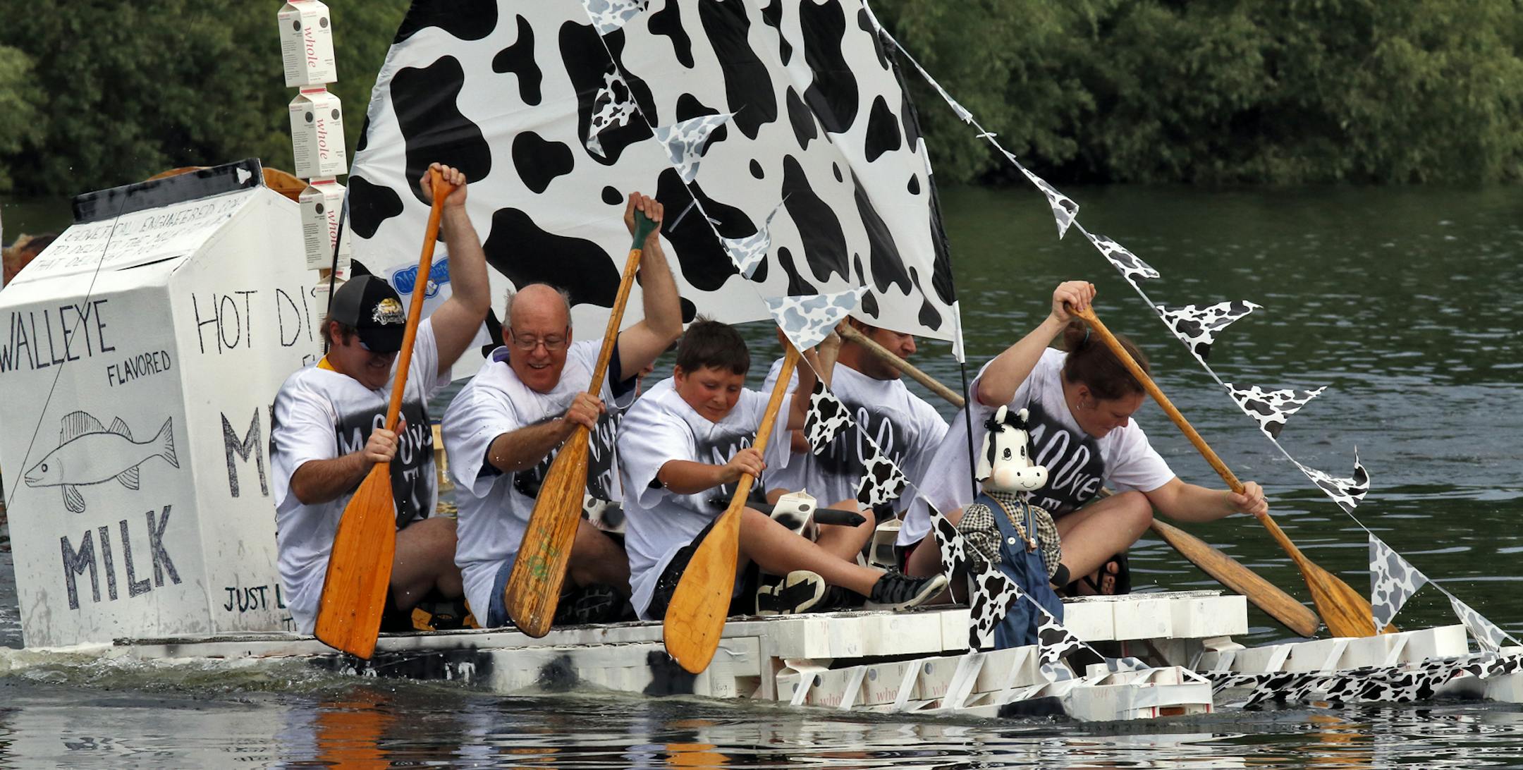 The Aquatennial's Milk Carton Boat Race at Lake Calhoun in Minneapolis. The Palzer family of Mounds View fashioned a dairy themed boat out of 370 milk cartons and went on to win the championship heat of the first round of races. (MARLIN LEVISON/STARTRIBUNE(mlevison@startribune.com