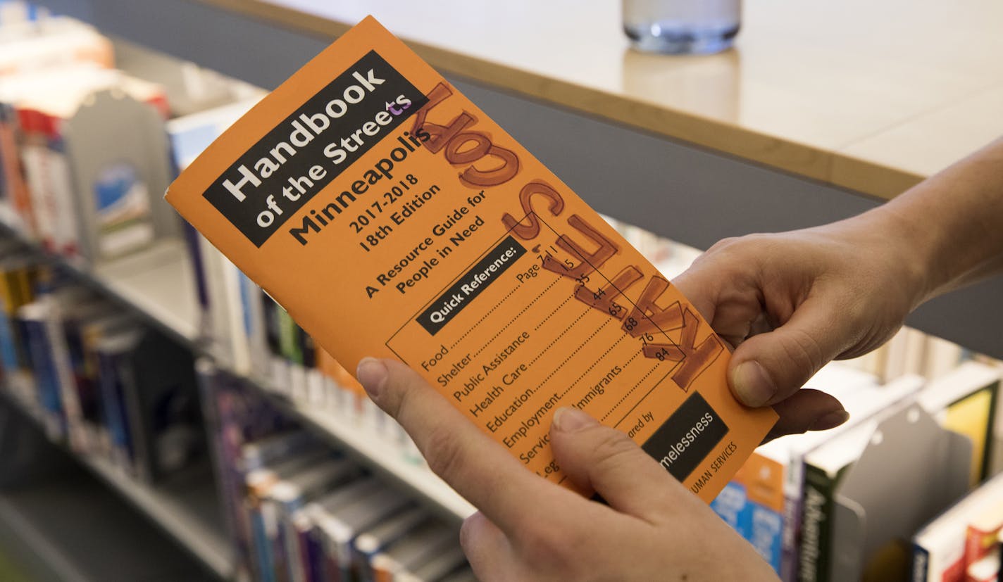 Kate Coleman holds her copy of Handbook of the Streets, which is an in-demand resource for homeless patrons of the library. ] LEILA NAVIDI &#xef; leila.navidi@startribune.com BACKGROUND INFORMATION: Kate Coleman works as Minneapolis Central Library's outreach coordinator on Tuesday, March 21, 2017. Hennepin County Libraries are adding a full-time social worker through St. Stephen's that will help with homeless people in the downtown library. The library has been beefing up the services it provid