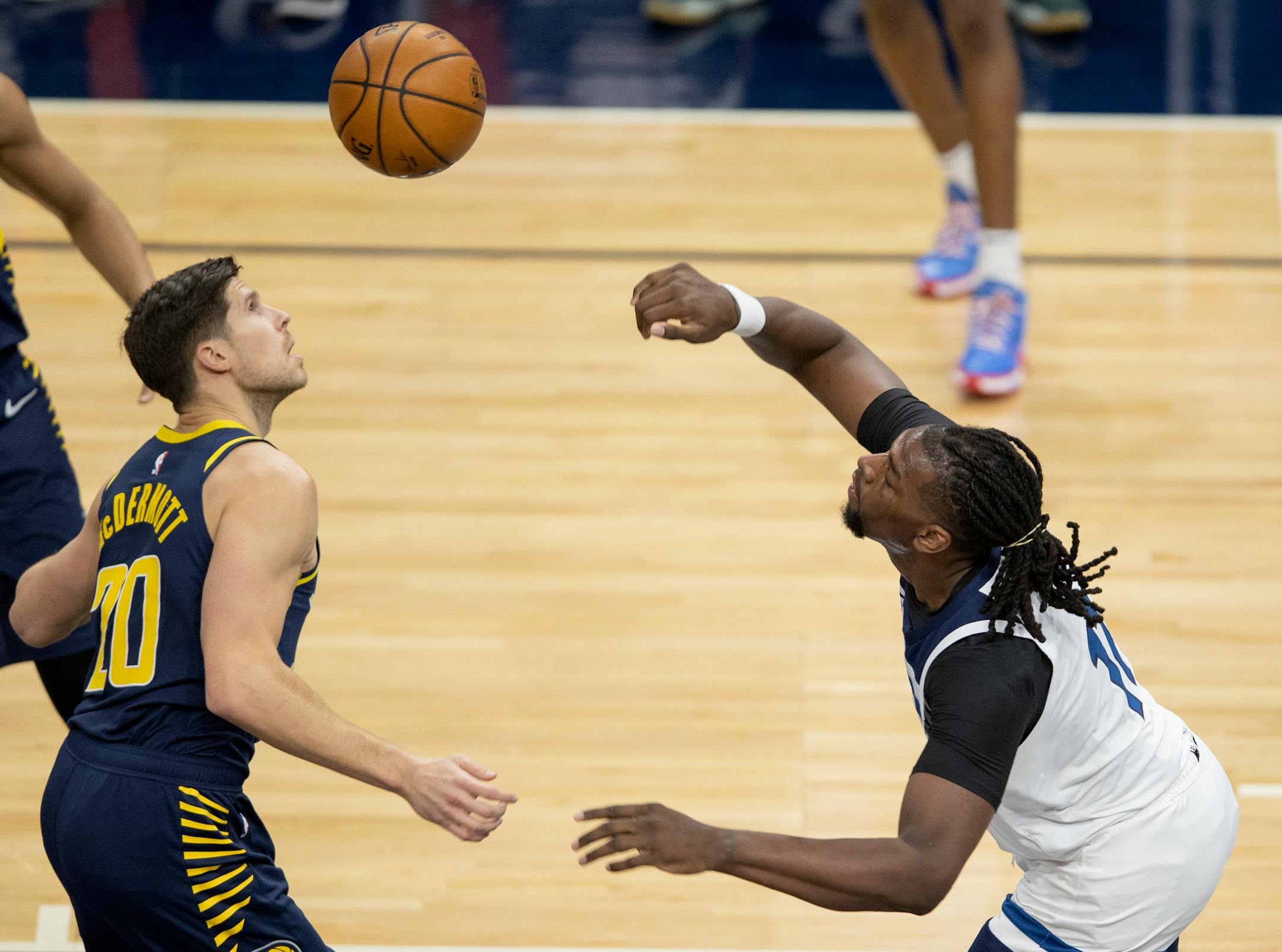 Minnesota Timberwolves Naz Reid (11) dunked the ball while defended by Doug McDermott (20) of the Indiana Pacers in the second quarter.