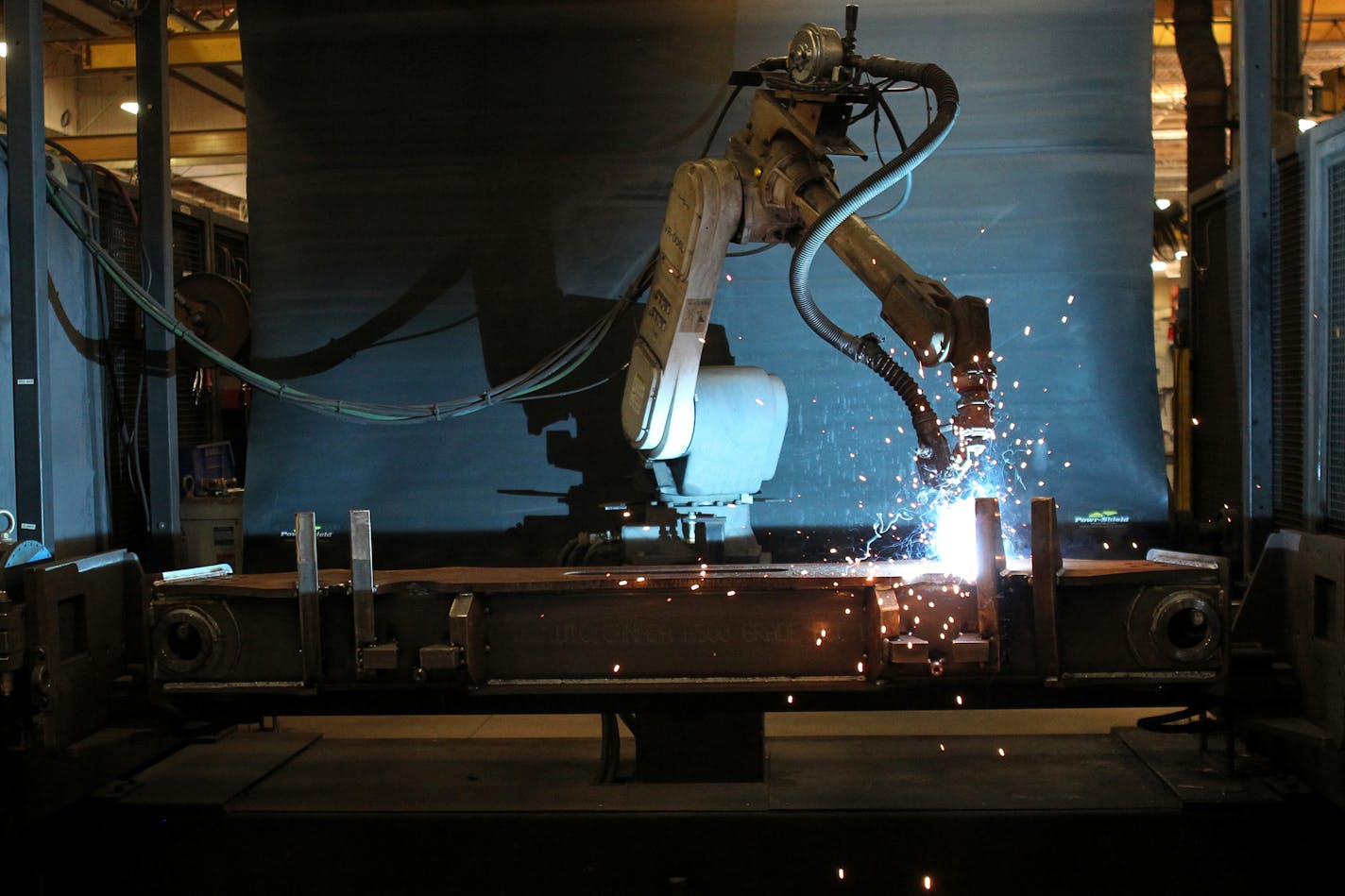 AGCO in Jackson is starting an apprenticeship program for electrical mechanics and welding. Pictured is one of the tractor plant's welding robots. (ANNA REED/Star Tribune file photo)