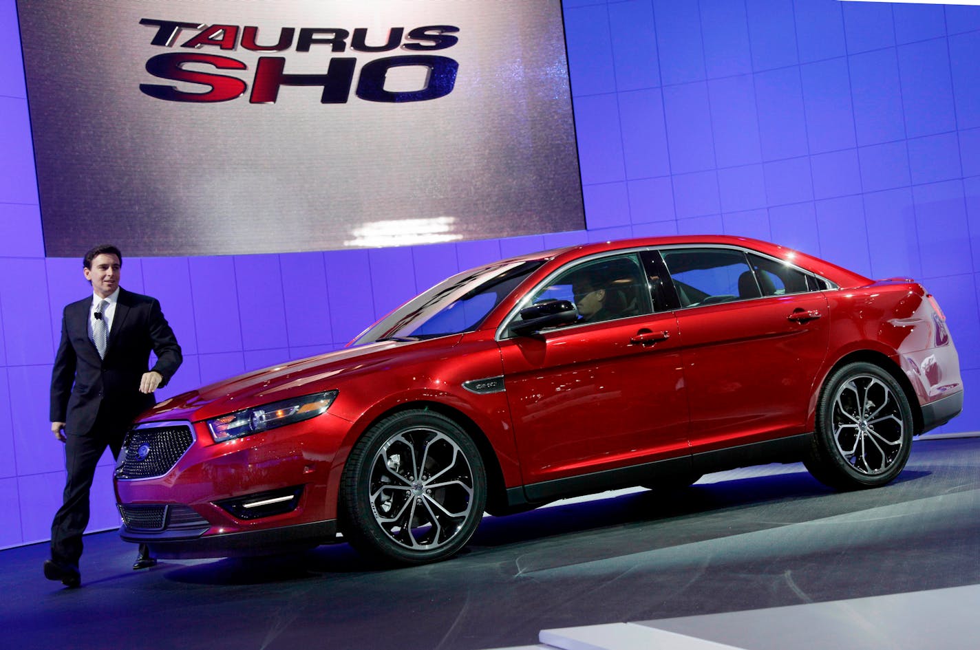 File- This April 20, 2011, file photo shows Mark Fields, executive vice president, Ford Motor Company, introducing the 2013 Ford Taurus SHO at the New York International Auto Show. In about a year, a car that once was the most popular in America will die for a second time. Ford Taurus, rest peacefully in heaven's salvage yard.