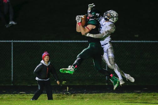 Holy Family tight end Ryan Bowlin hauls in a 17-yard touchdown reception against Dassel-Cokato. Bowlin had two TD catches in the Fire's 32-7 victory over the Chargers in Victoria. Photo by Jeff Lawler, SportsEngine