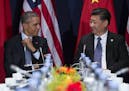 President Barack Obama, left, meets with Chinese President Xi Jinping during the COP21, United Nations Climate Change Conference, in Le Bourget, outsi