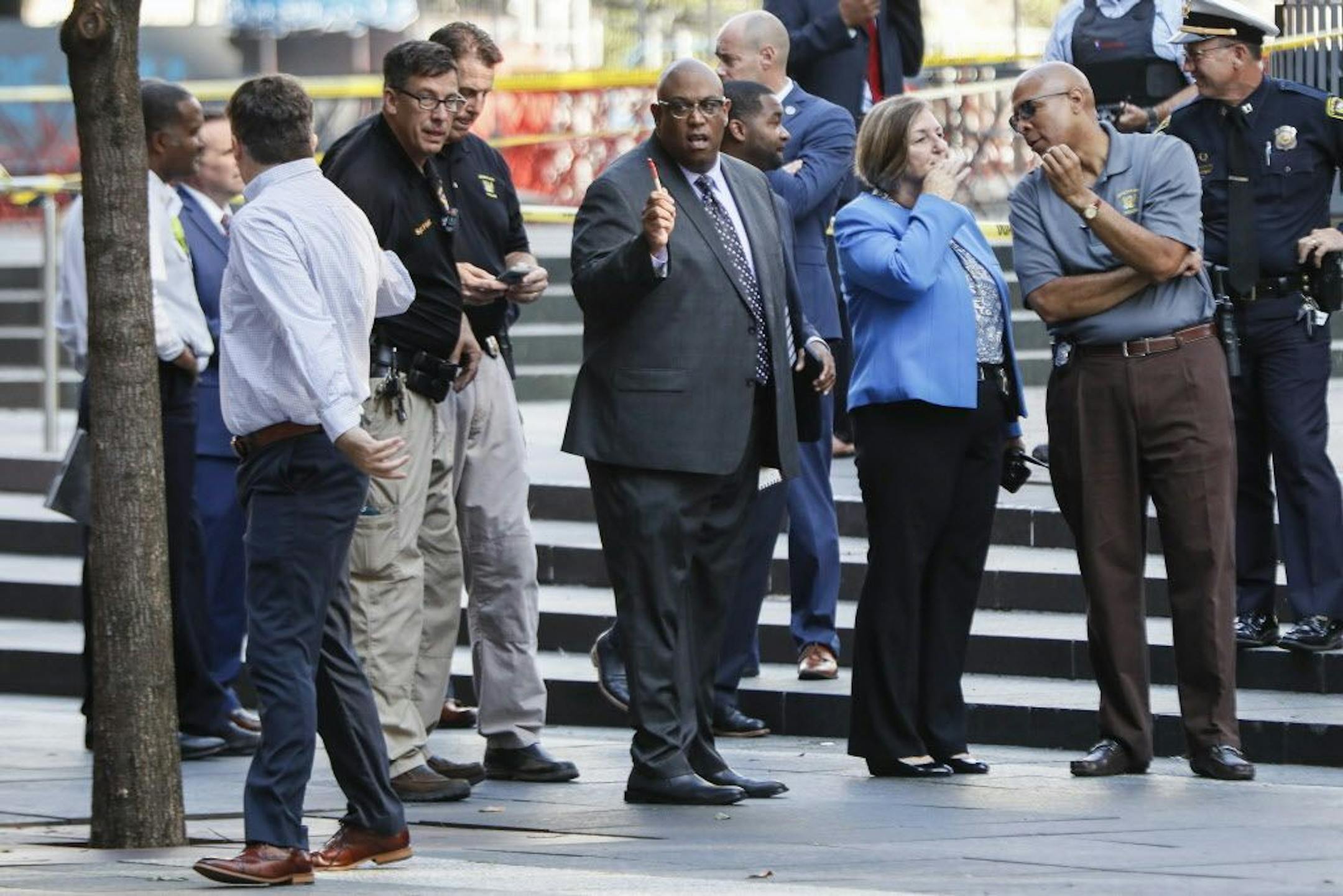 Cincinnati Police Chief Eliot Isaac, center, works the scene as emergency personnel and police respond to reports of a shooting near Fountain Square, Thursday, Sept. 6, 2018, in downtown Cincinnati.