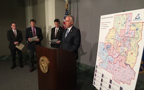 Rep. Tony Albright, R-Prior Lake, discusses Metropolitan Council reform at a news conference Monday. He was joined, left to right, by Blaine City Coun