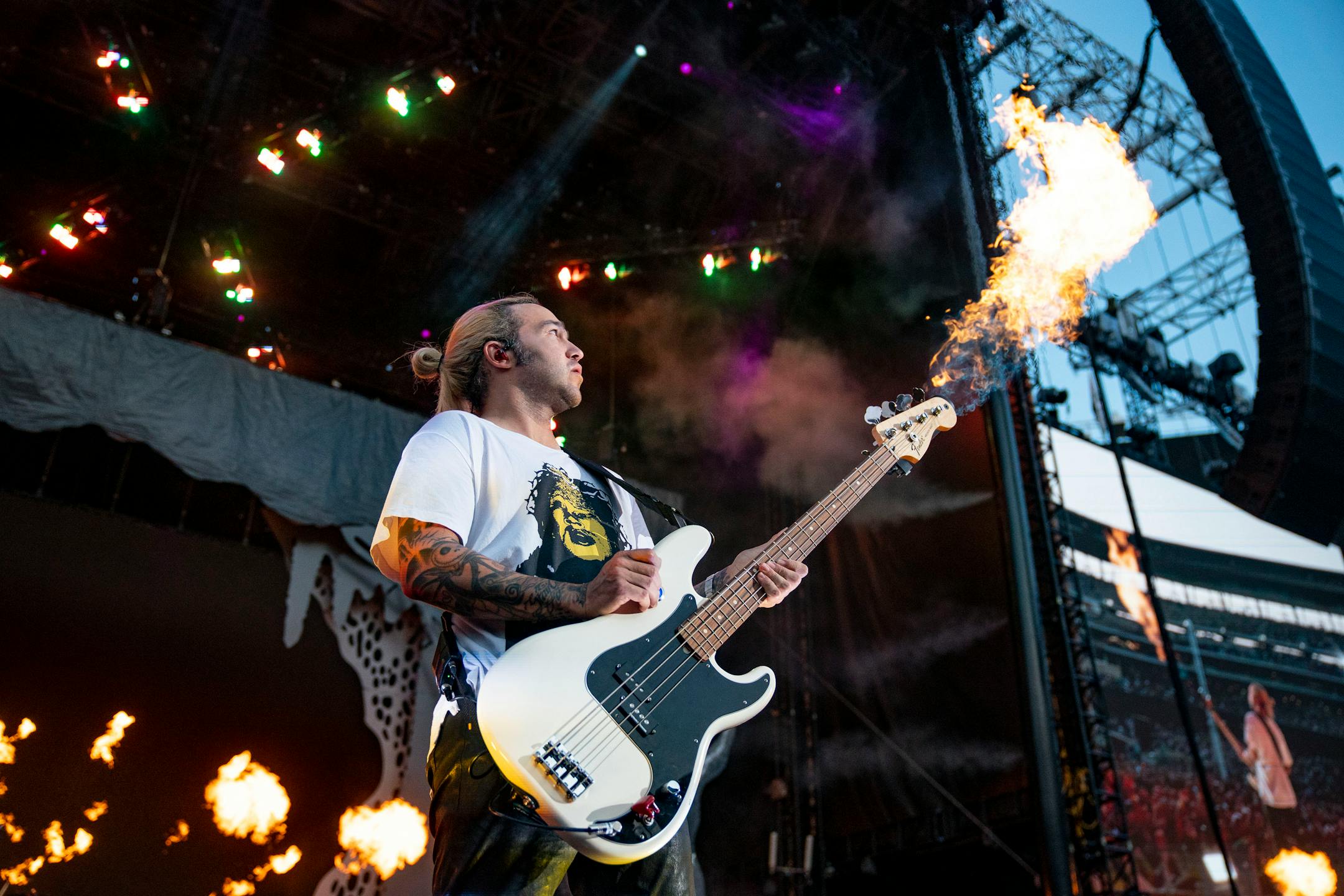 Pete Wentz, bassist for Fall Out Boy, shot flames out of his bass during the band's opening song at the Hella Mega Tour at Target Field in Minneapolis on Monday.