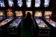Chad Lietz of Columbia Heights played the Jurassic Park game at Litt Pinball Bar in Minneapolis. The machines have cameras placed over them to allow o