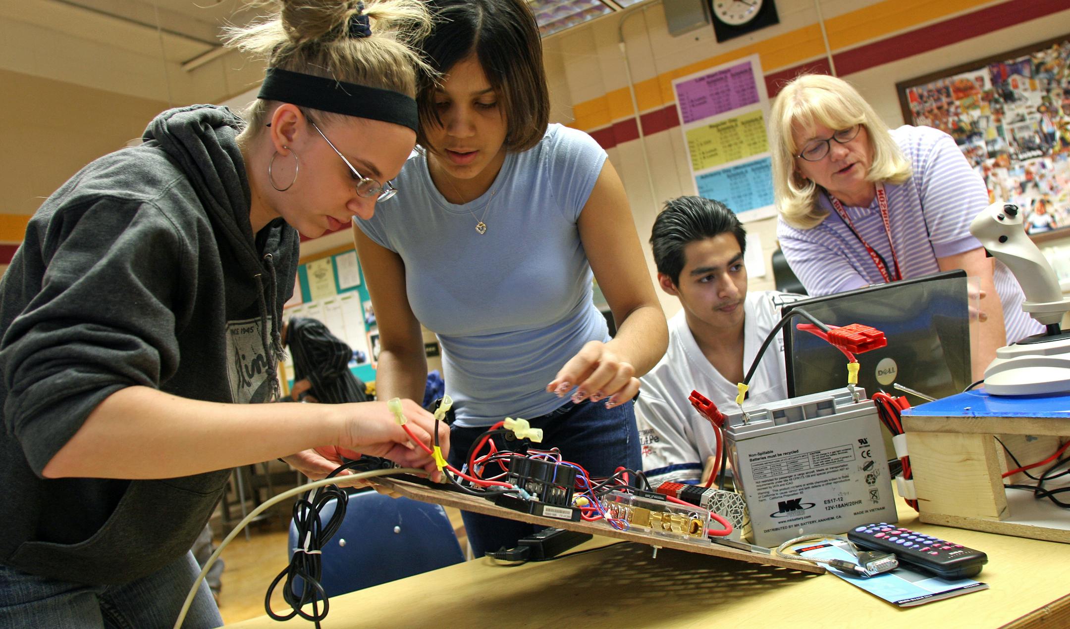 This is the first year for Patrick Henry in the competition. At work, from left, were Mindy Blom, Schanell Gauna, Andrade and teacher Jill Johnson. The regional will be March 27 to March 29 at the University of Minnesota's Williams Arena.