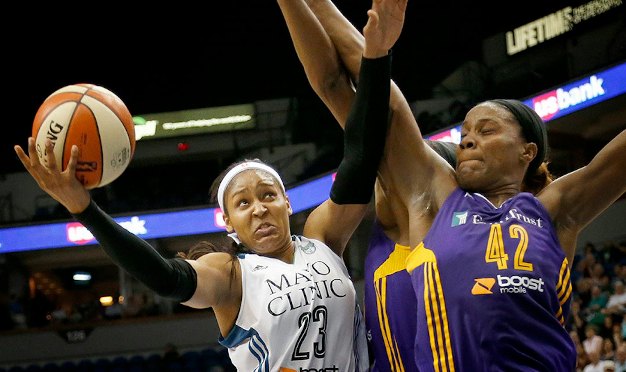 Minnesota Lynx Maya Moore (23) attempted a shot while being defended by Jantel Lavender (42) in the second quarter.