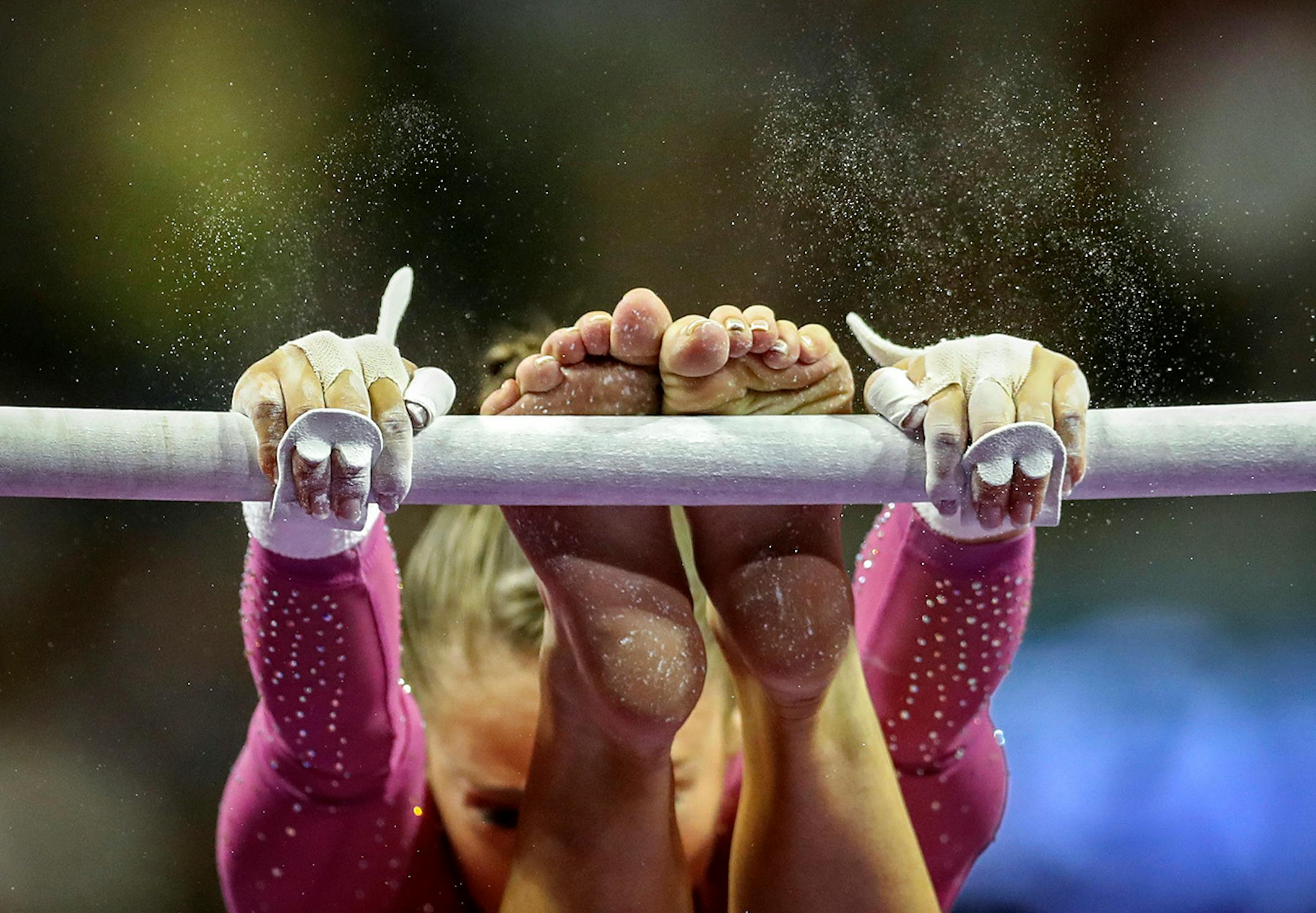 Day 1 - Christina Desiderio gripped the bar during her uneven bar performance Friday night.