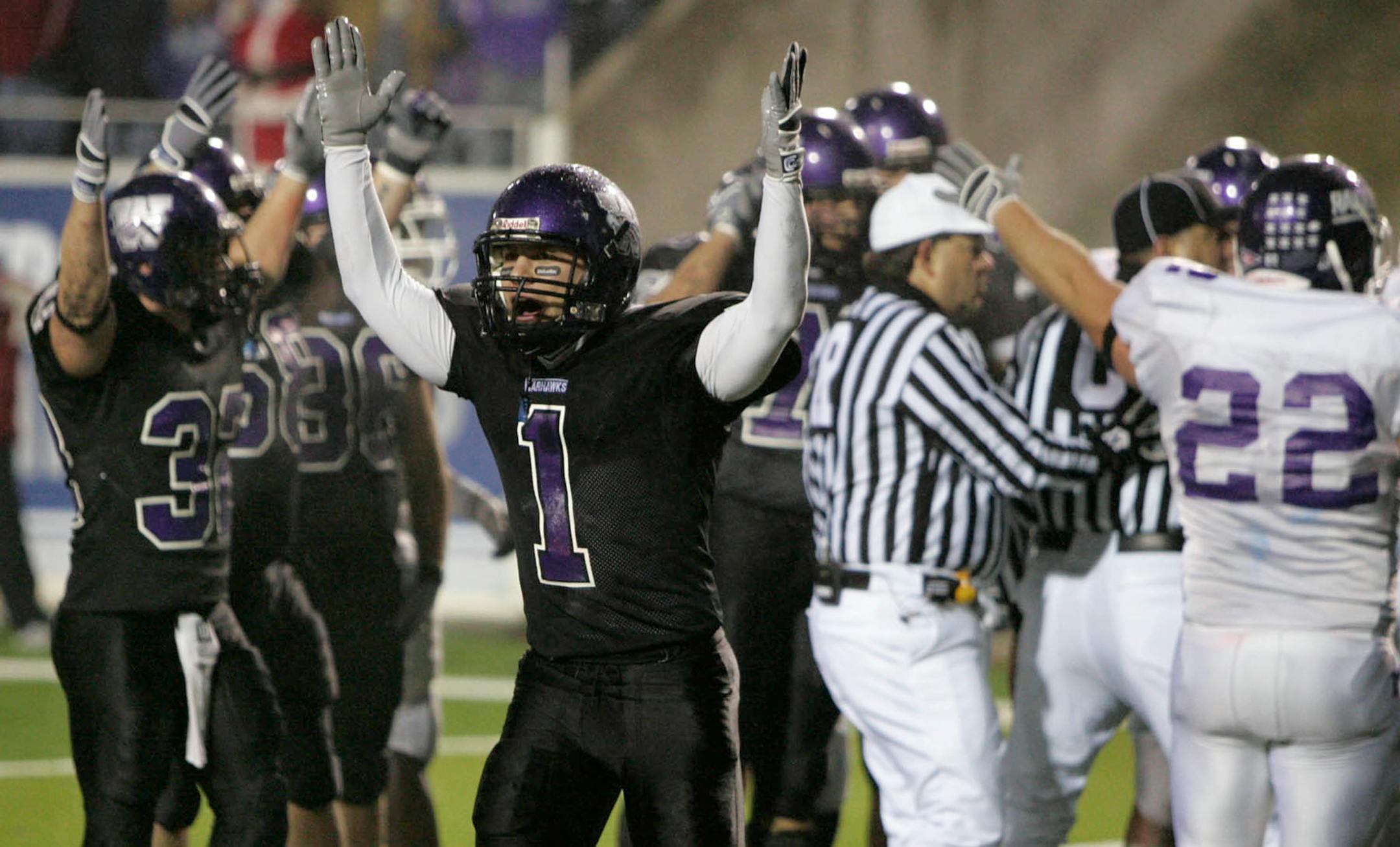 Wisconsin-Whitewater wide receiver Neil Mrkvicka, left, signals touchdown after teammate Michael Sherman fell on a fumble in the end zone during the Mt. Union Purple Raiders 31-21 loss to the Warhawks in the Division III 2007 Amos Alonzo Stagg Bowl at Salem Stadium on Saturday, December 15, 2007, in Salem, Virginia. (Ed Suba Jr./Akron Beacon Journal/MCT)