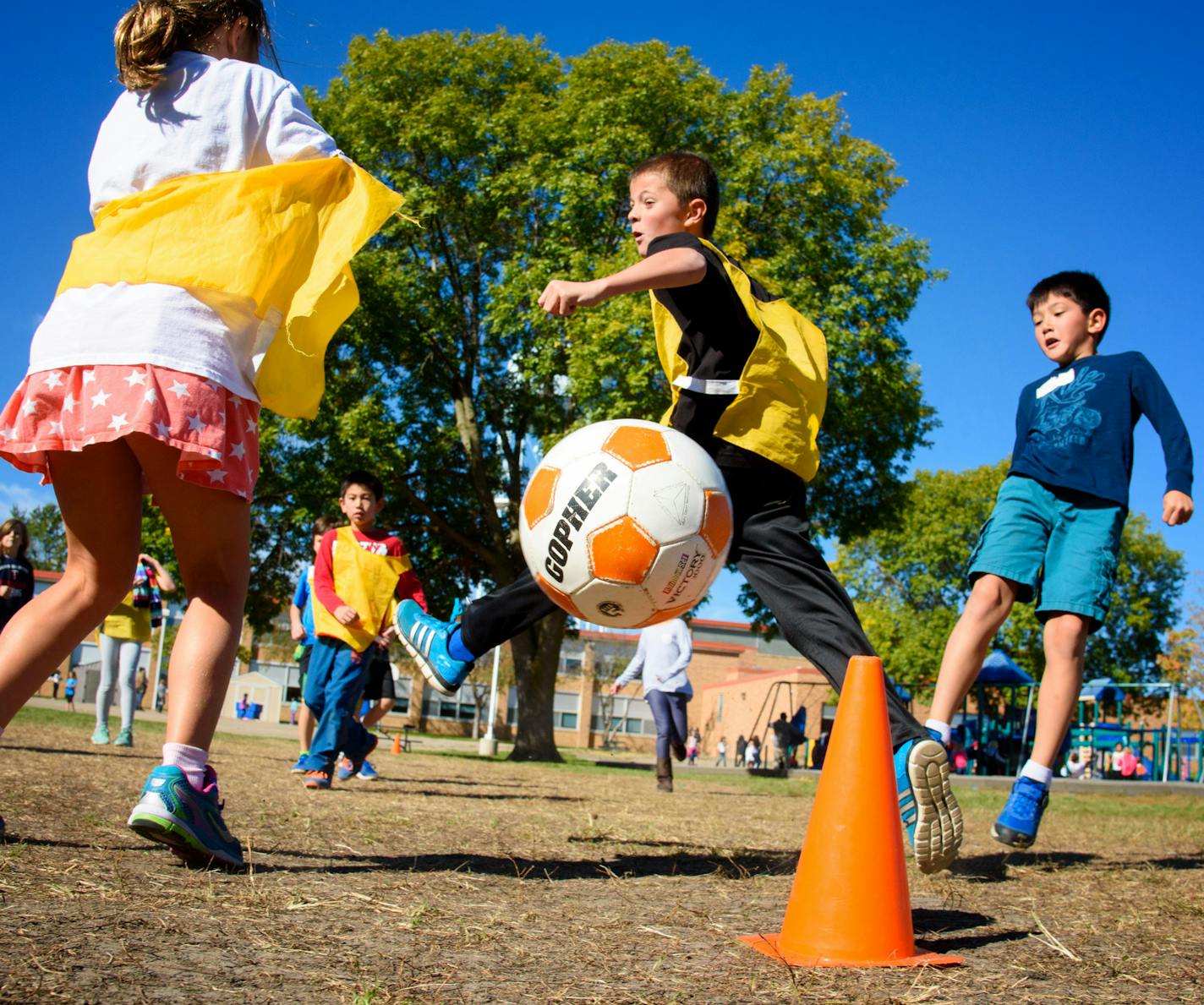 Third-graders at Concord Elementary in Edina played a recess soccer game overseen by a recess coach. Use of a recess consultant has drawn support and opposition.