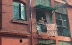 A man takes in the morning from his balcony in Kolkata, India. Photo by Diane Richard * Special to the Star Tribune