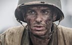 This image released by Summit shows Andrew Garfield in a scene from "Hacksaw Ridge." On Wednesday, Dec. 14, 2016, Garfield was nominated for a Screen 