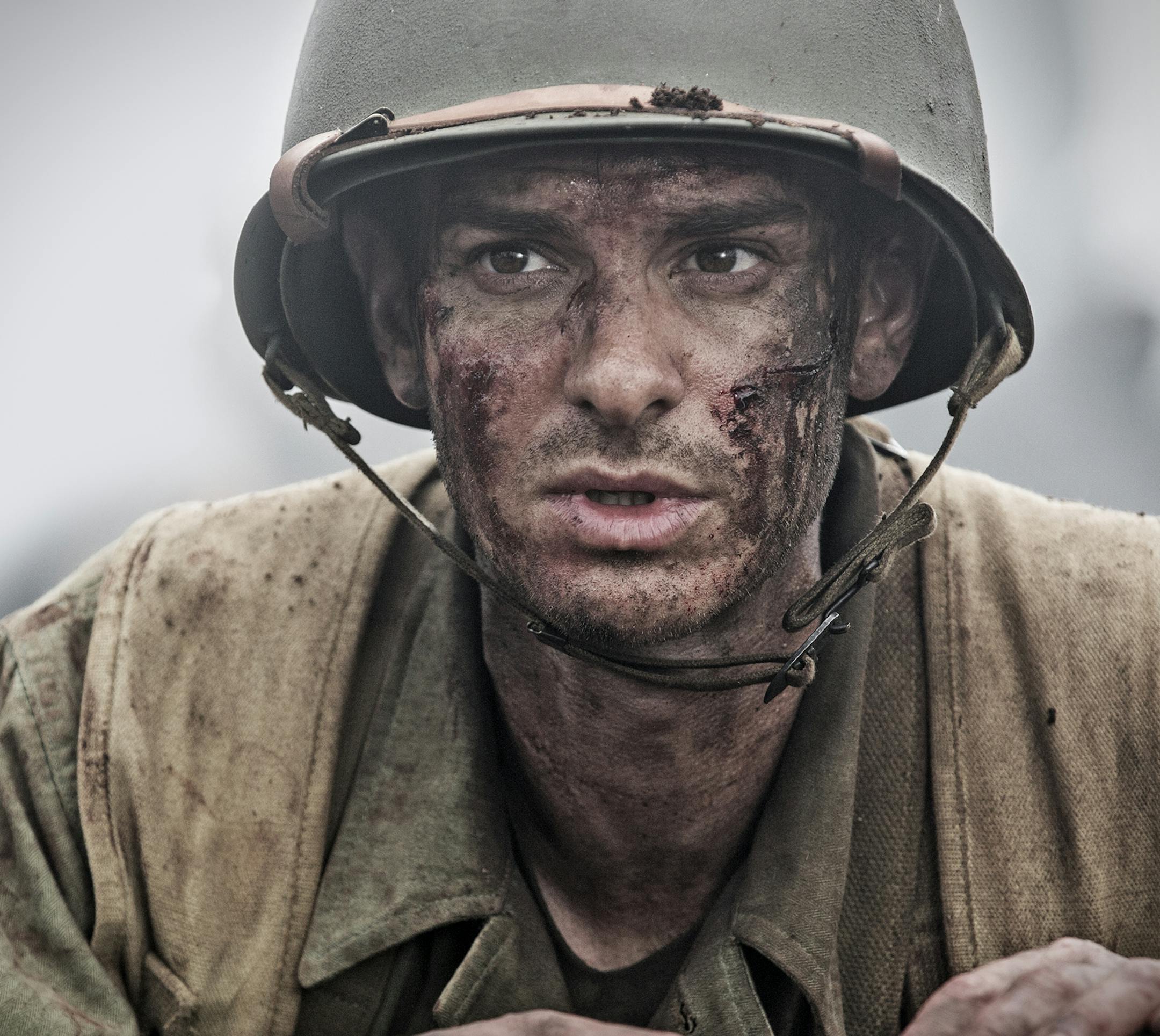 This image released by Summit shows Andrew Garfield in a scene from "Hacksaw Ridge." On Wednesday, Dec. 14, 2016, Garfield was nominated for a Screen Actors Guild award for outstanding performance by a male actor in a leading role for his role in the film. (Mark Rogers/Summit via AP)