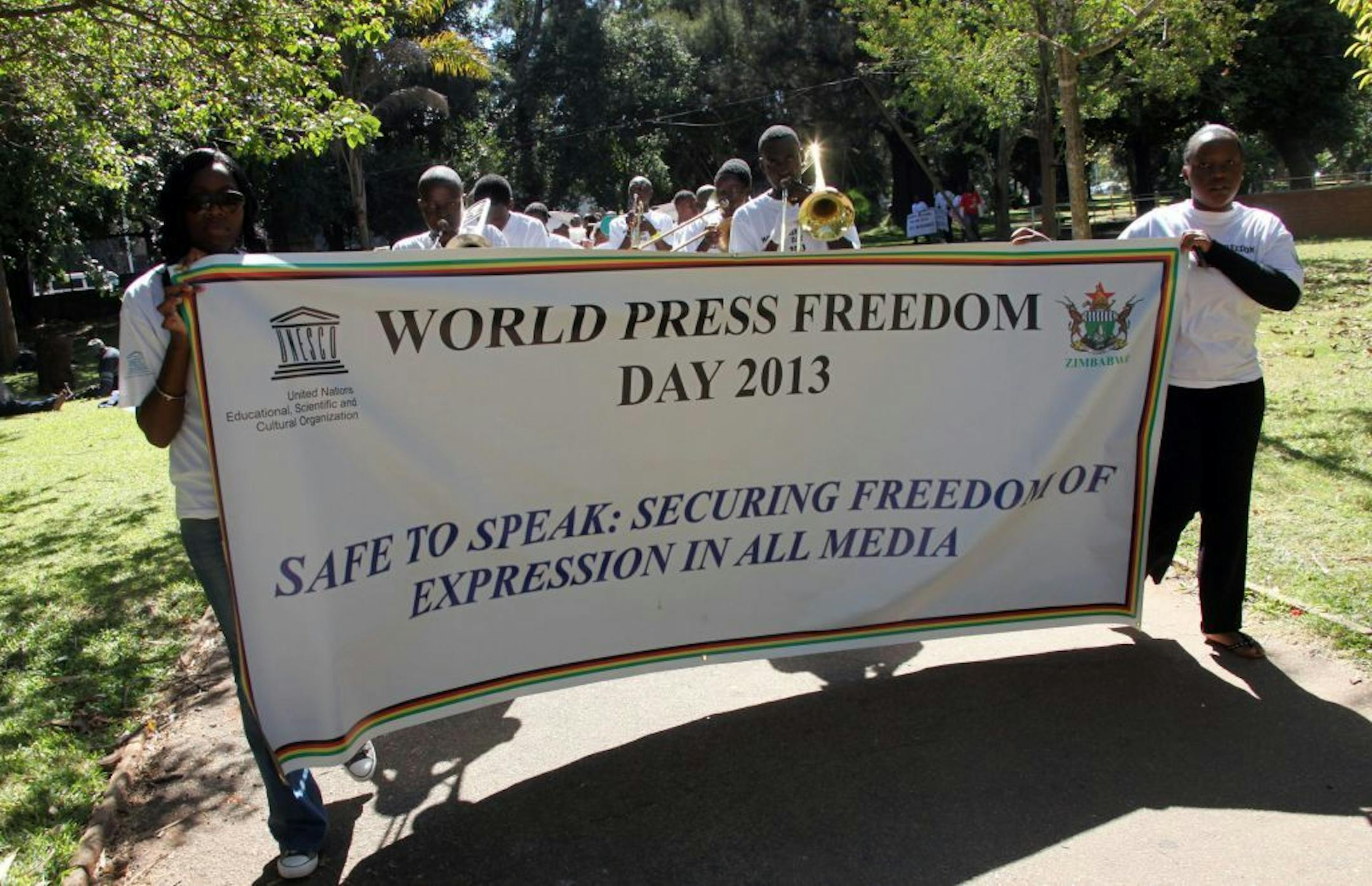 Zimbabwean journalists take part in a march to commemorate World Press Freedom Day in Harare, Friday May 3, 2013. The country's journalist body called on the government to address media reform issues which would pave the way for a better working environment for journalists working in the country.