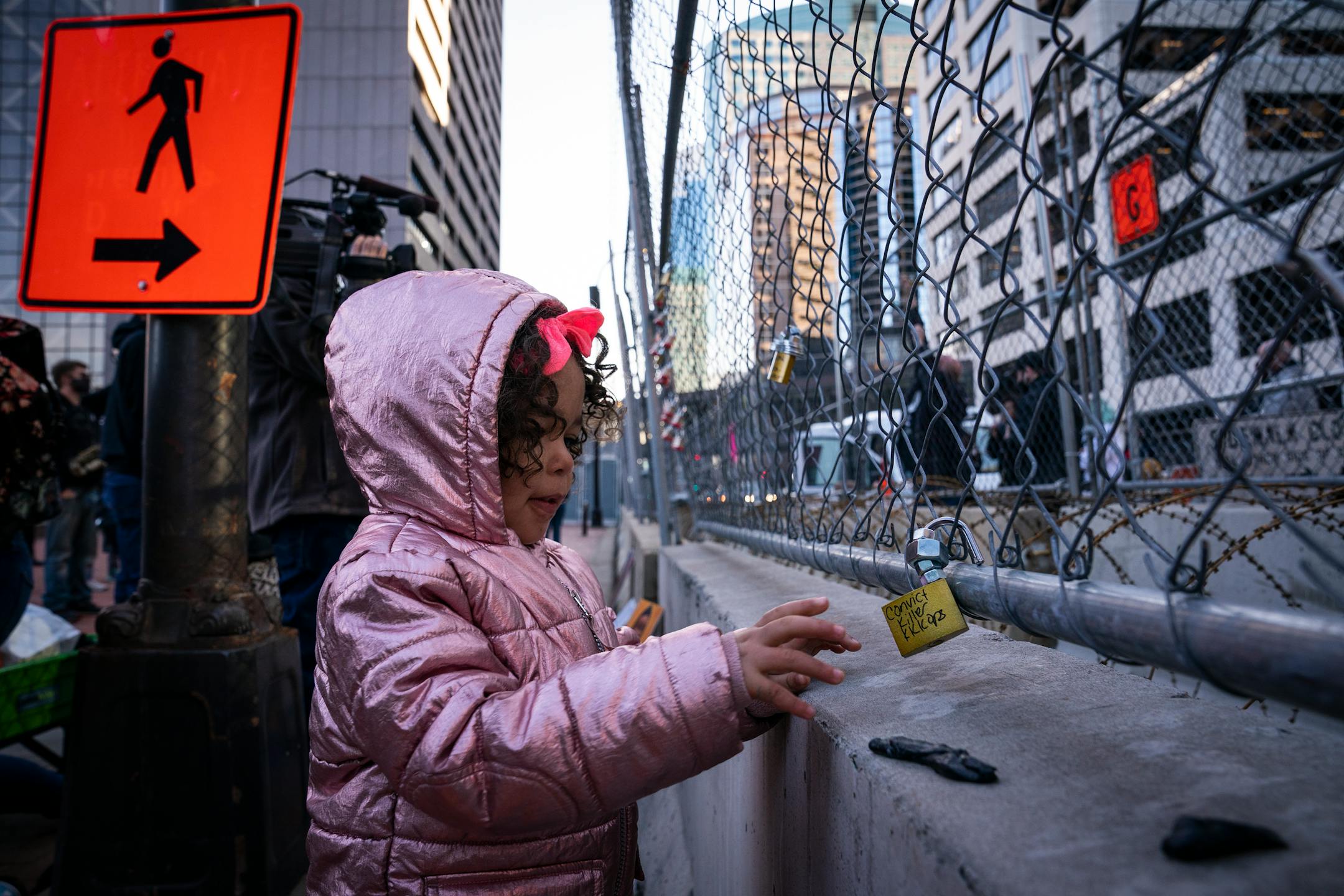 Zeriah Myette, 4, of Elk River placed a lock on the fence outside the Hennepin County Government Center during the Locks for Loved Ones Lost: Part II event.