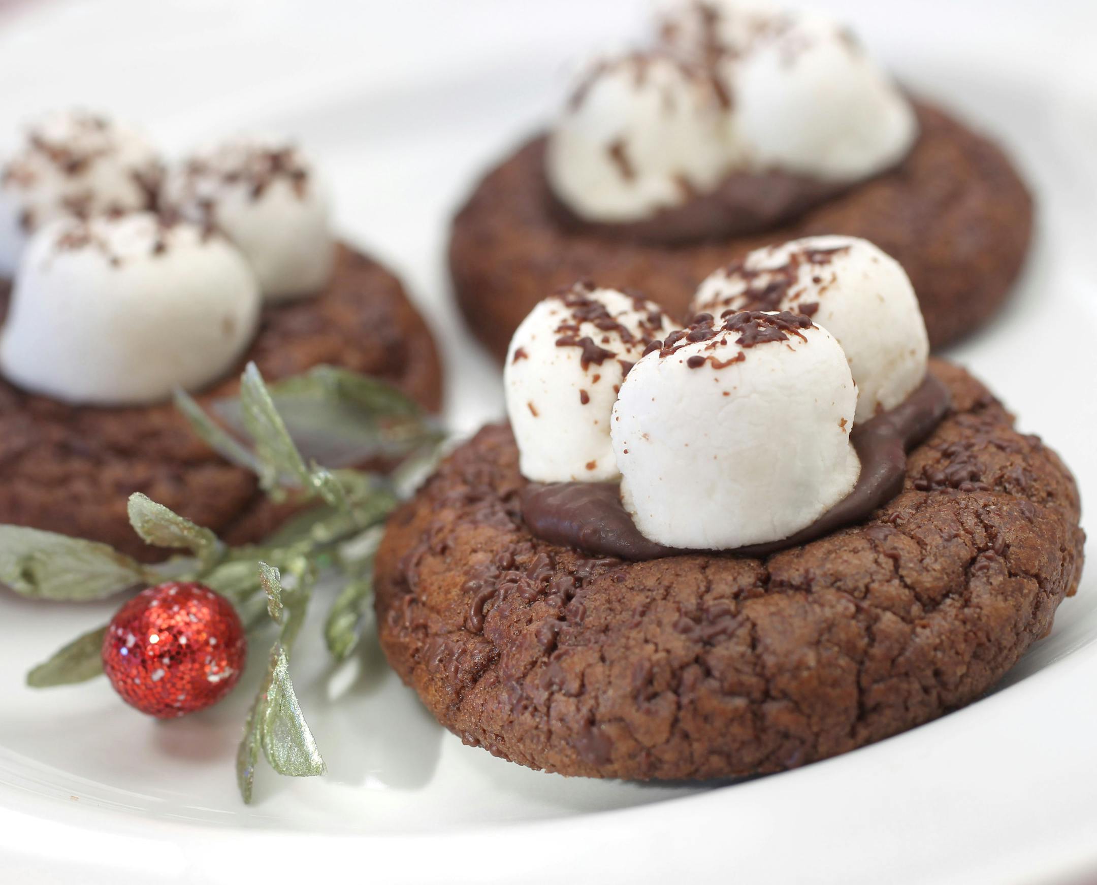 In this photo: Hot Cocoa Cookies [ 2013 winners in Taste holiday cookie contest: Winner:&#xa7; Cappuccino Flat Finalists: &#xa7;Candy Cane Sugar Cookies, Cinnamon Bun Cookies, Orange-Almond Melting Moments, Hot Cocoa Cookies Photos by Tom Wallace, styled by Lee Dean October 29, 2013