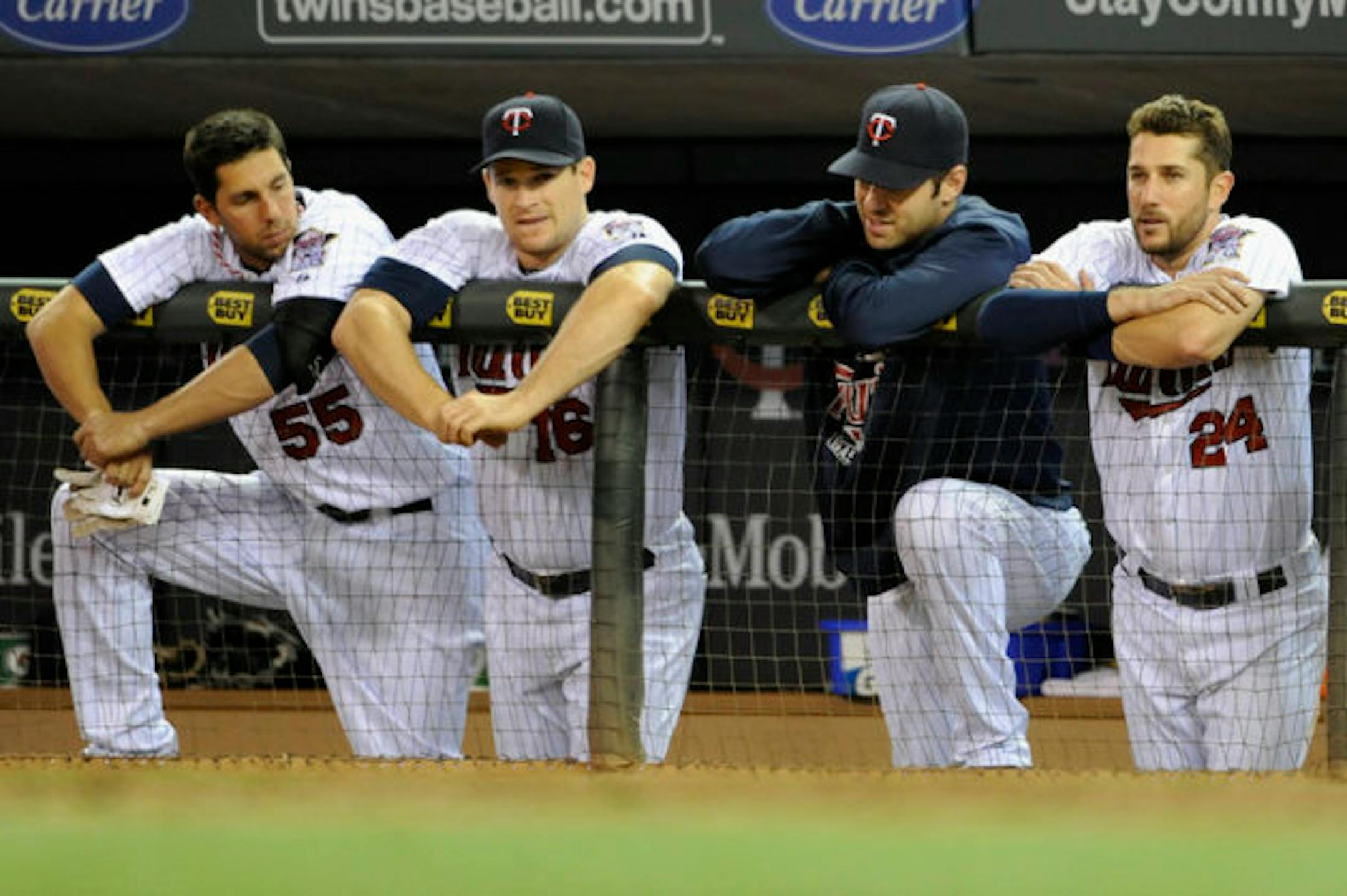 MINNEAPOLIS, MN - SEPTEMBER 27: (L-R) Chris Colabello #55, Josh Willingham #16, Joe Mauer #7 and Trevor Plouffe #24 of the Minnesota Twins look on during the ninth inning of the game against the Cleveland Indians on September 27, 2013 at Target Field in Minneapolis, Minnesota. The Indians defeated the Twins 12-6. (Photo by Hannah Foslien/Getty Images)