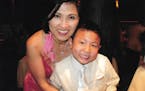 A family photo of mother and son restaurateurs Khue and Eric Pham.