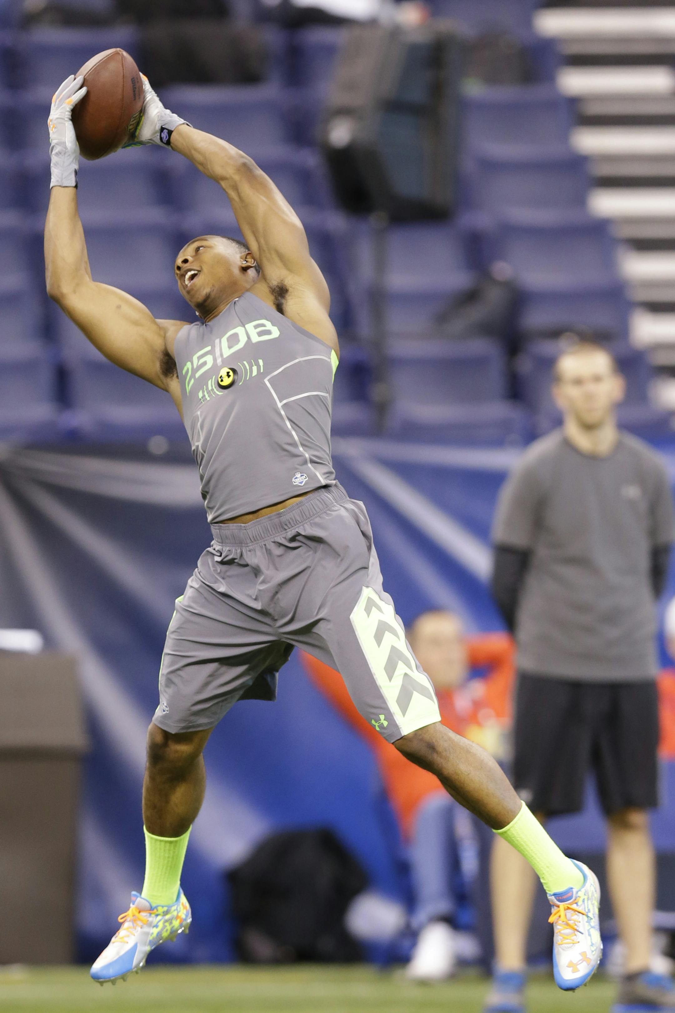 Oklahoma State defensive back Justin Gilbert runs a drill at the NFL football scouting combine in Indianapolis, Tuesday, Feb. 25, 2014. (AP Photo/Michael Conroy) ORG XMIT: NYOTK