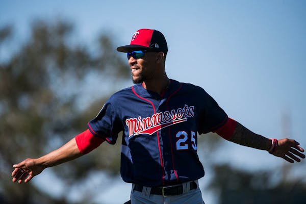 Twins outfielder Byron Buxton (25) stretched before workouts.