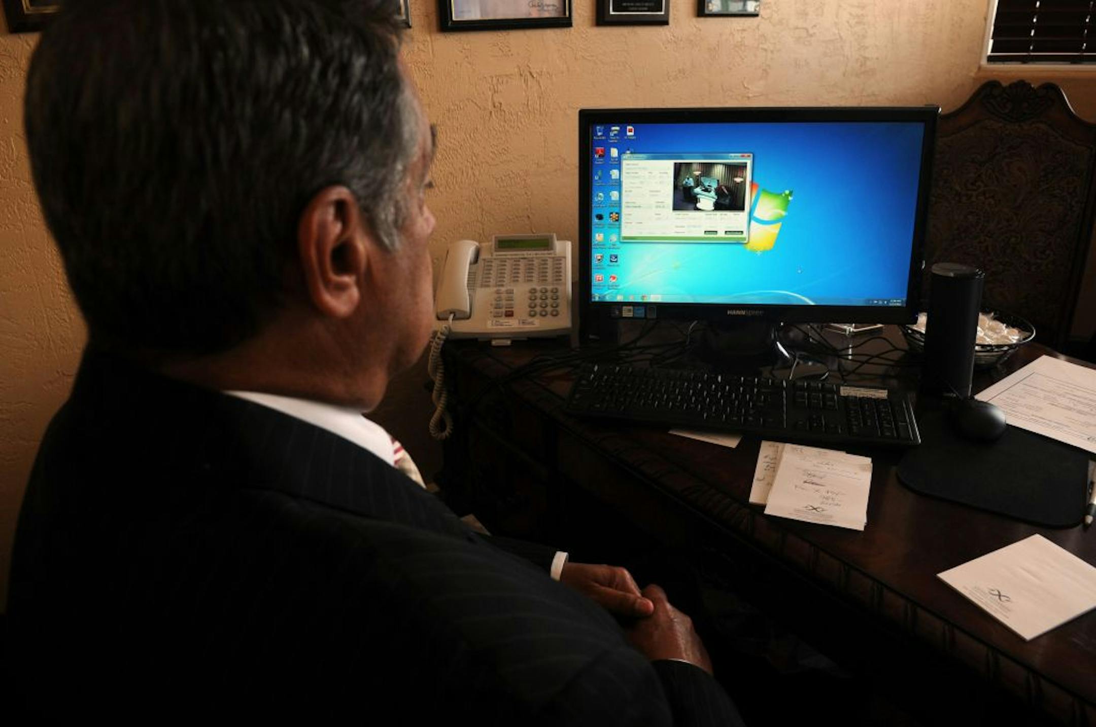 Mark Weissman of Savino-Weissman Funeral Home & Cremation Services monitored a live Web broadcast of a funeral service to make sure there were no glitches in the Internet feed.