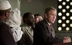 President Bush delivers a statement as he stands with Muslim religious leaders during a visit to the Islamic Center of Washington, Monday, Sept. 16, 2