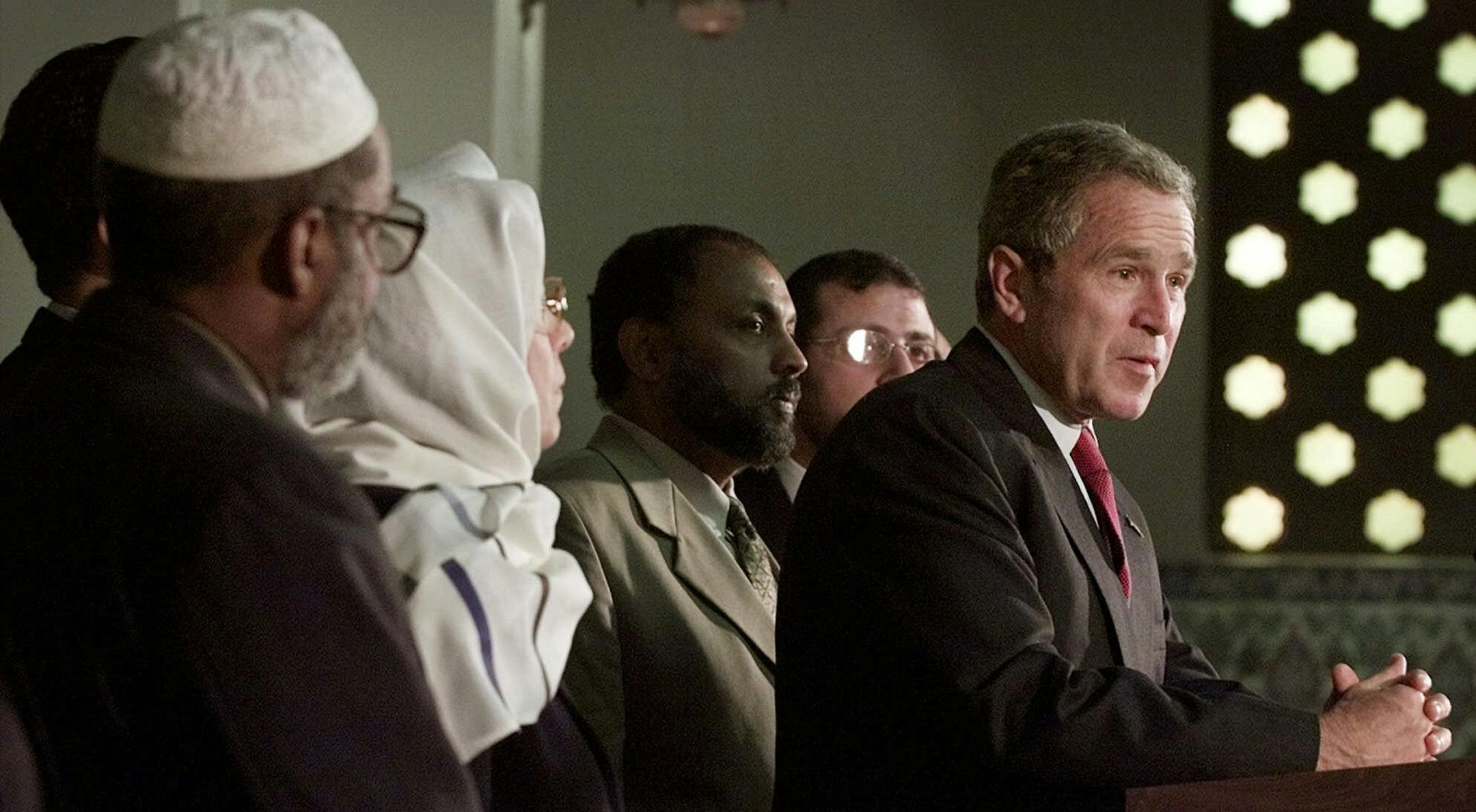 President Bush delivers a statement as he stands with Muslim religious leaders during a visit to the Islamic Center of Washington, Monday, Sept. 16, 2001, to try to put an end to rising anti-Muslim sentiment in the wake of last week's terrorist attacks. (AP Photo/Doug Mills) ORG XMIT: DSM204,DSM204