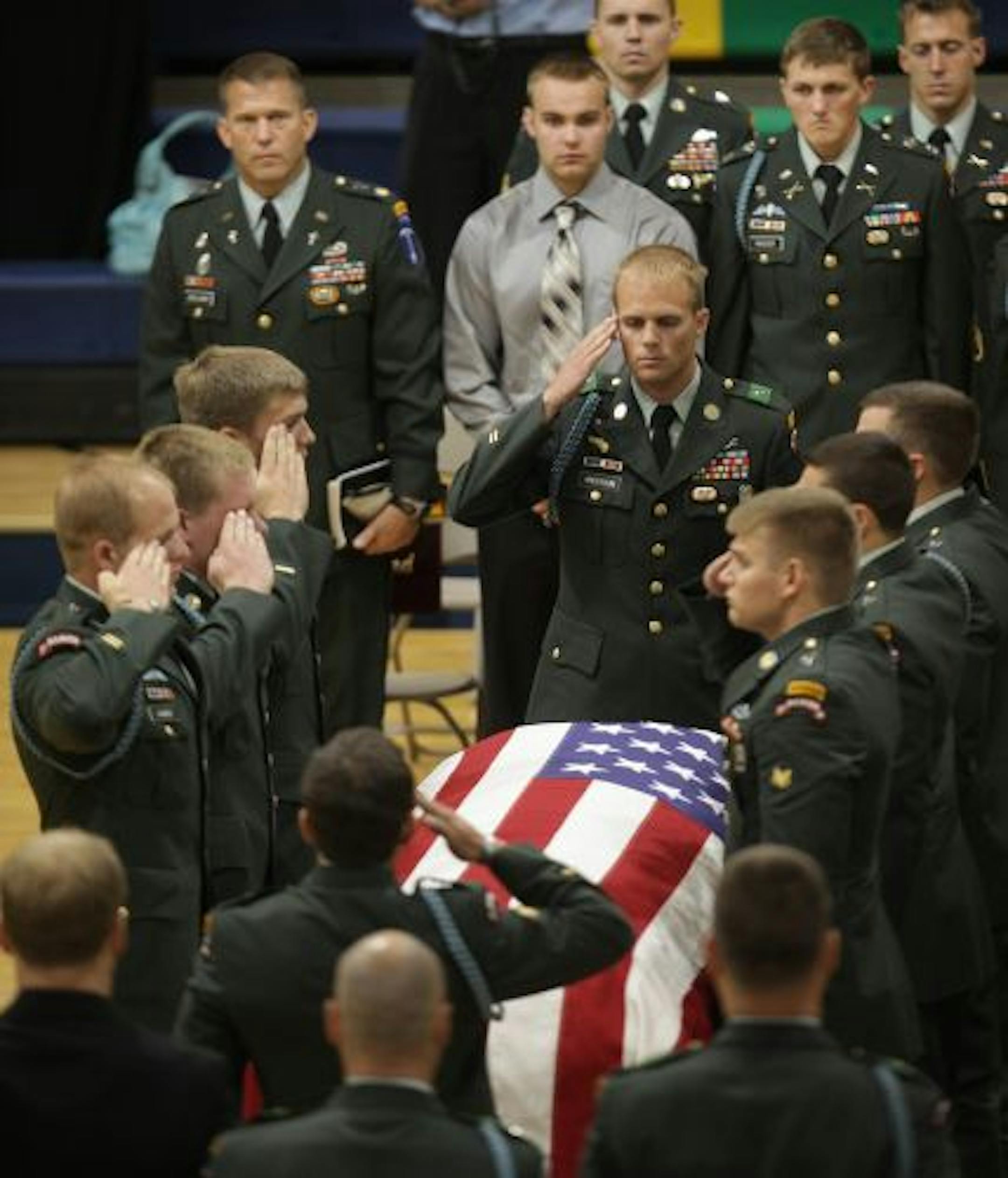 Rangers from the 75th Ranger Regiment saluted the casket of Corporal Benjamin S. Kopp at the end of his funeral held at Rosemount High School.