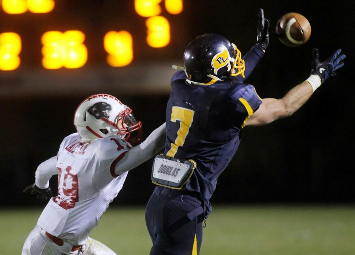 Matt Arends caught a pass for Prior Lake, a team making its state football tournament debut this week, against Lakeville North's Michael Koloski earlier this season.