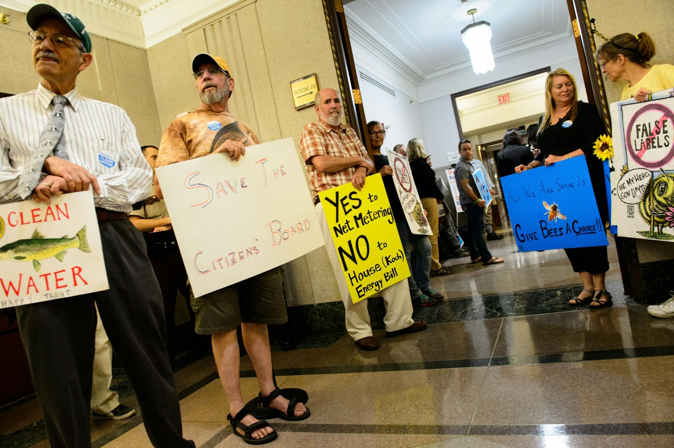Environmental activists gathered outside the temporary House and Senate chambers to object to the environment bill.