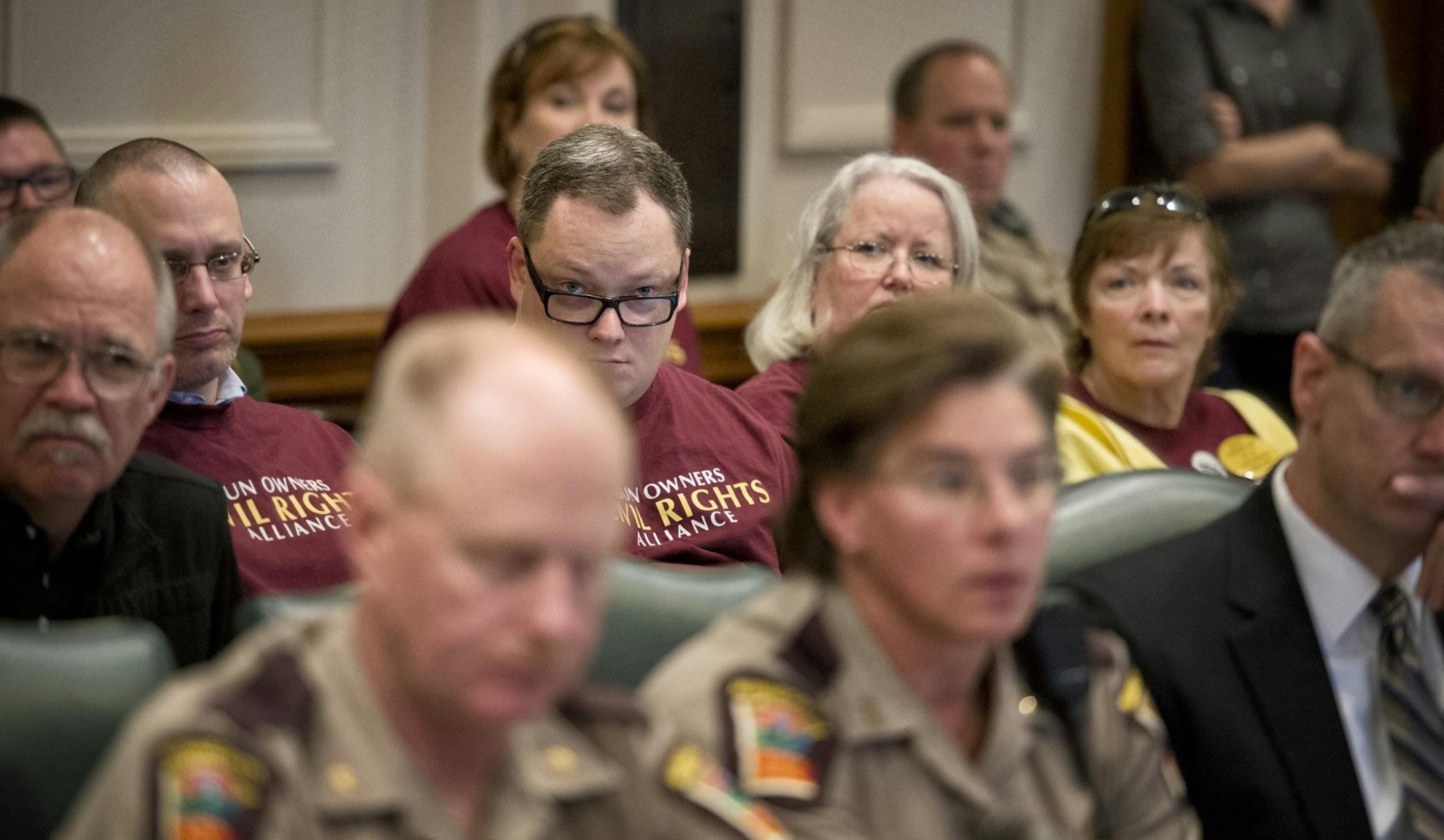 Gun rights advocates listened to testimony at Wednesday’s hearing. Minnesotans with gun permits may bring them in the Capitol if they notify officials.