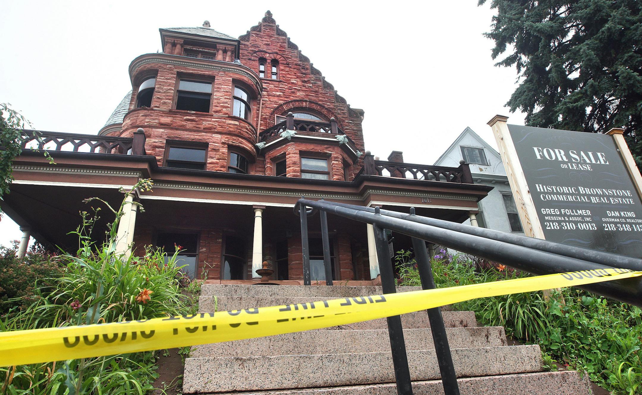 t8.18.14 Bob King -- kingARSON0819c1 -- Police tape surrounds the historic mansion at 1511 E. Superior St. Monday morning after an arson fire earlier that morning.