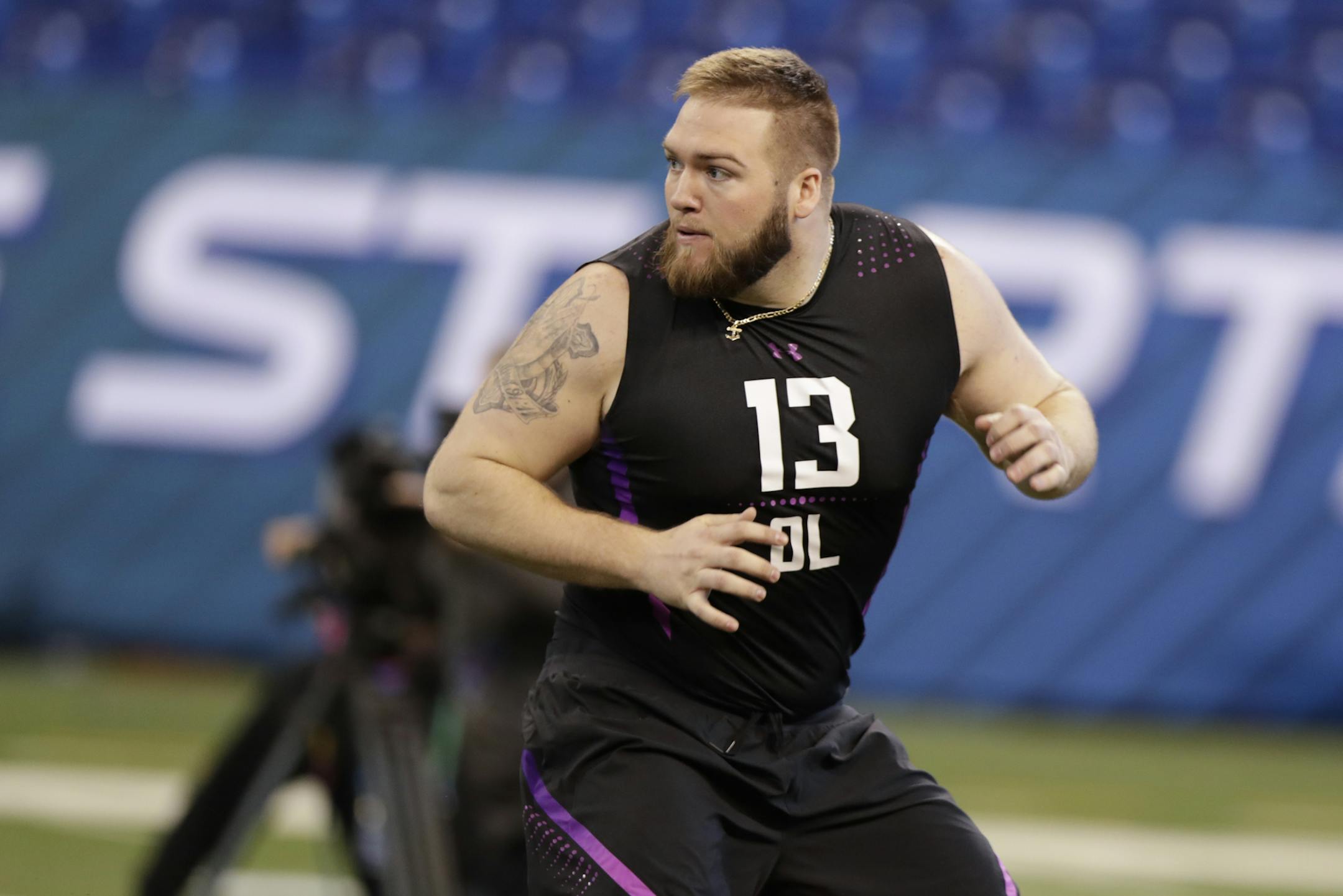 Appalachian State offensive lineman Colby Gossett runs a drill at the NFL football scouting combine in Indianapolis, Friday, March 2, 2018. (AP Photo/Michael Conroy) ORG XMIT: INMC10