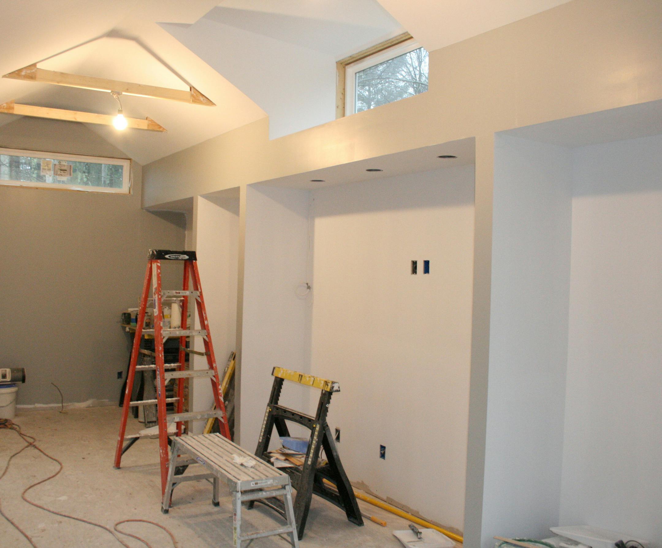 In a newly built home office studio, a niche is for an entertainment sideboard and wall-mounted television that will able to be concealed by sliding barn doors. (Handout/TNS) ORG XMIT: 1176499