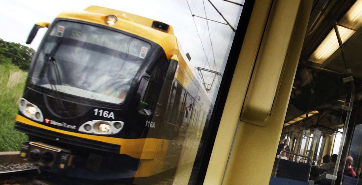 DAVID JOLES &#xef; djoles@startribune.com -June 2, 2011- Minneapolis, MN- In this photo:] Riders take the light-rail during morning rush hour. Once derided as a &#xec;train to nowhere," the Hiawatha light-rail line carries enough riders over 12 miles that it's cheaper to run than city buses. The daily cost per passenger mile of operating the Hiawatha between Bloomington and downtown Minneapolis is nearly half that of metro buses throughout the Twin Cities, according to the federal government. Th