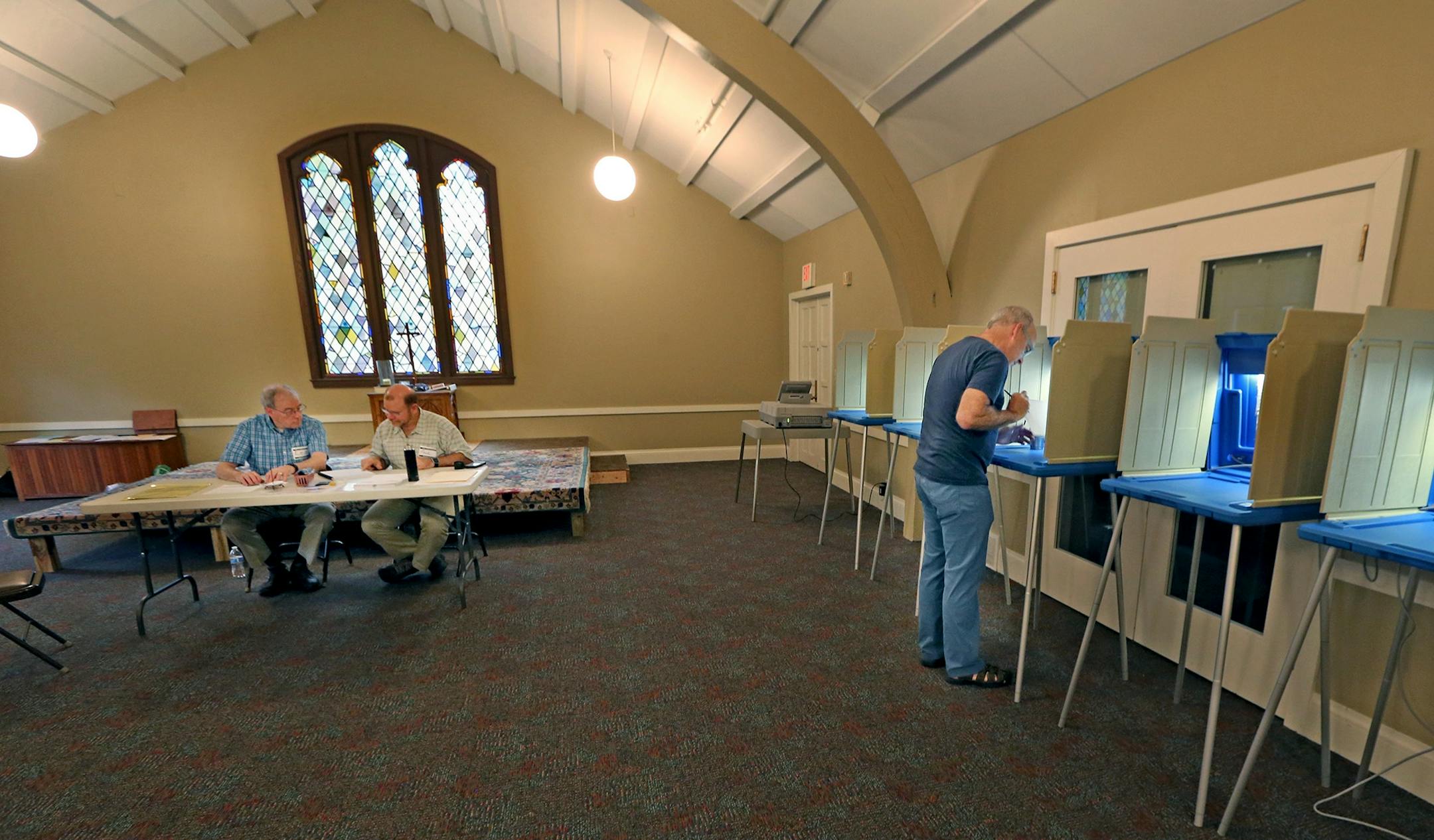 Tom MacLeod, right, voted at St. John's Episcopal Church, Tuesday, August 9, 2016 in Minneapolis, MN.