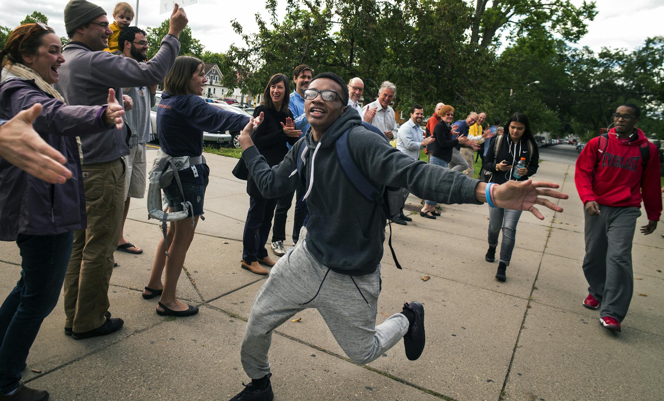 At South H.S. in Minneapolis, community members welcomed back students to the first day of school including Set.h McCurry,16, a sophomore who said, "Summer got boring towards the end." As you might guess, McCurry runs track and is going to try out for football.] Richard Tsong-Taatarii/rtsong-taatarii@startribune.com