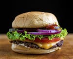 A diner-style burger, smashed thin and cooked crisp on its edges, in New York, June 2014. The secret to cooking a great hamburger is simple, experts s