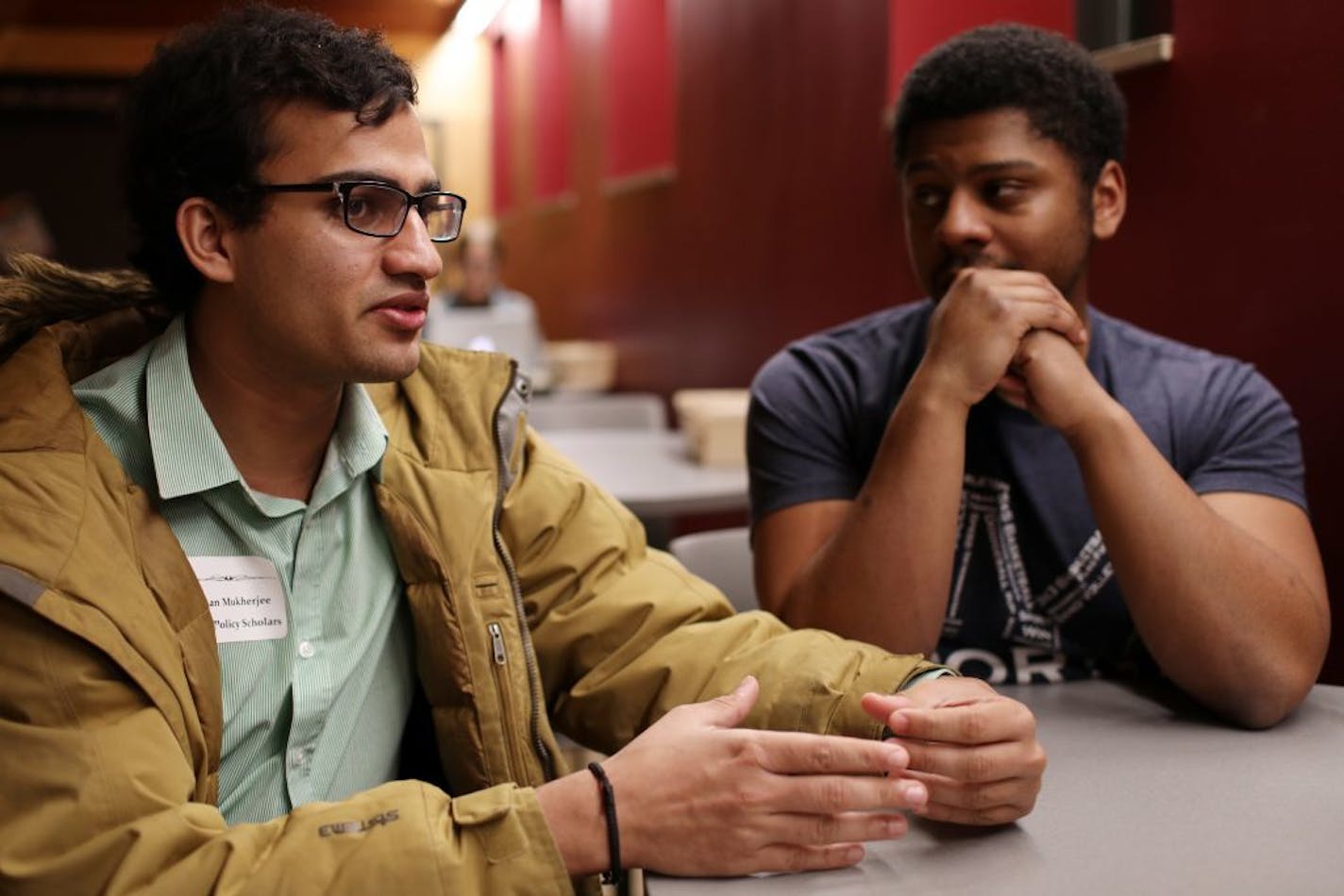 Rohan Mukherjee, left, a libertarian, and Sharaka Berry, right, a liberal, discussed how they're working to bring those with differing political views together at Carleton College.