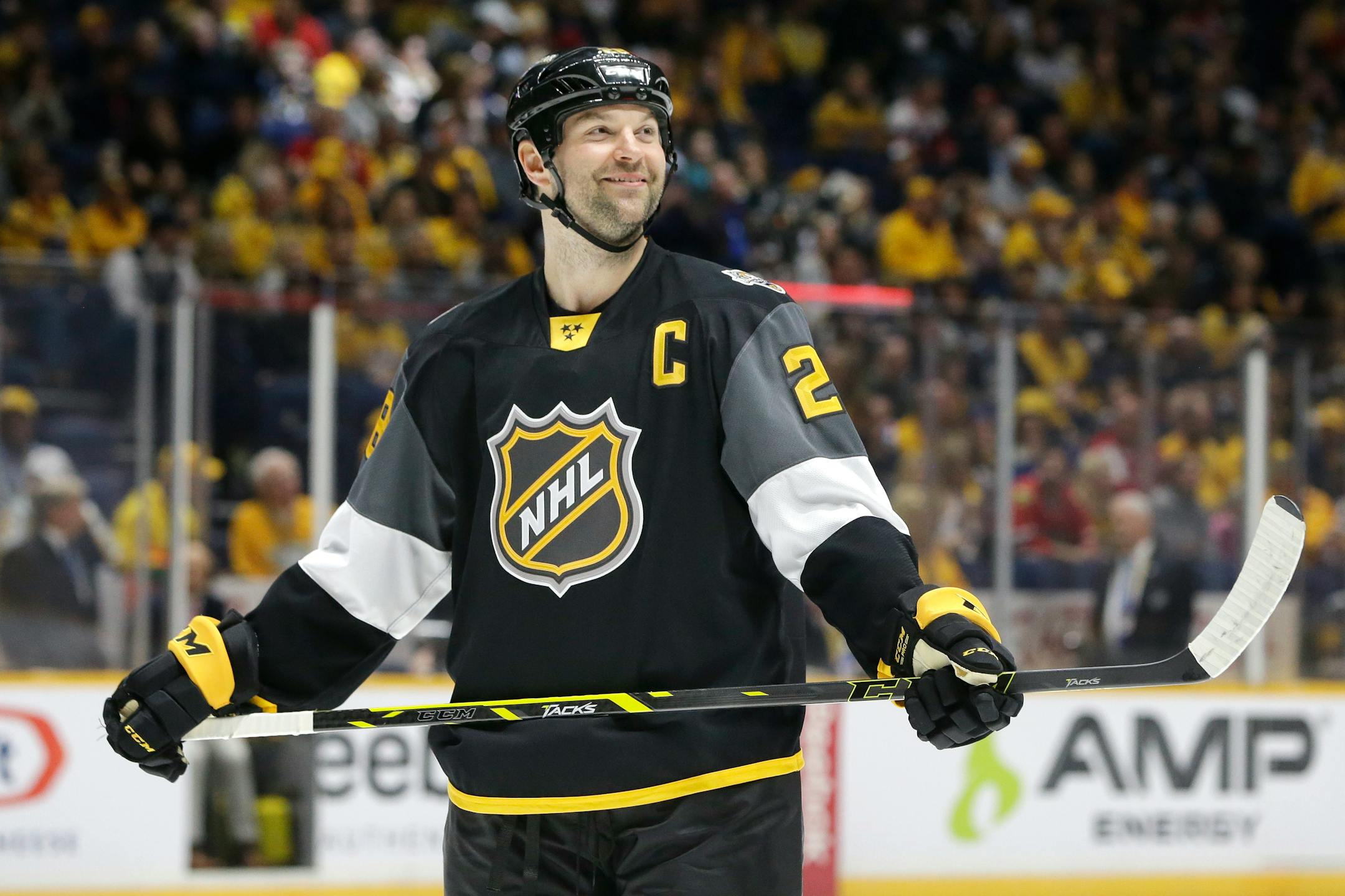 Pacific Division forward John Scott looks into the stands during the NHL hockey All-Star championship game against the Atlantic Division Sunday, Jan. 31, 2016, in Nashville, Tenn. The Pacific Division won 1-0 and Scott was named most valuable player. (AP Photo/Mark Humphrey)