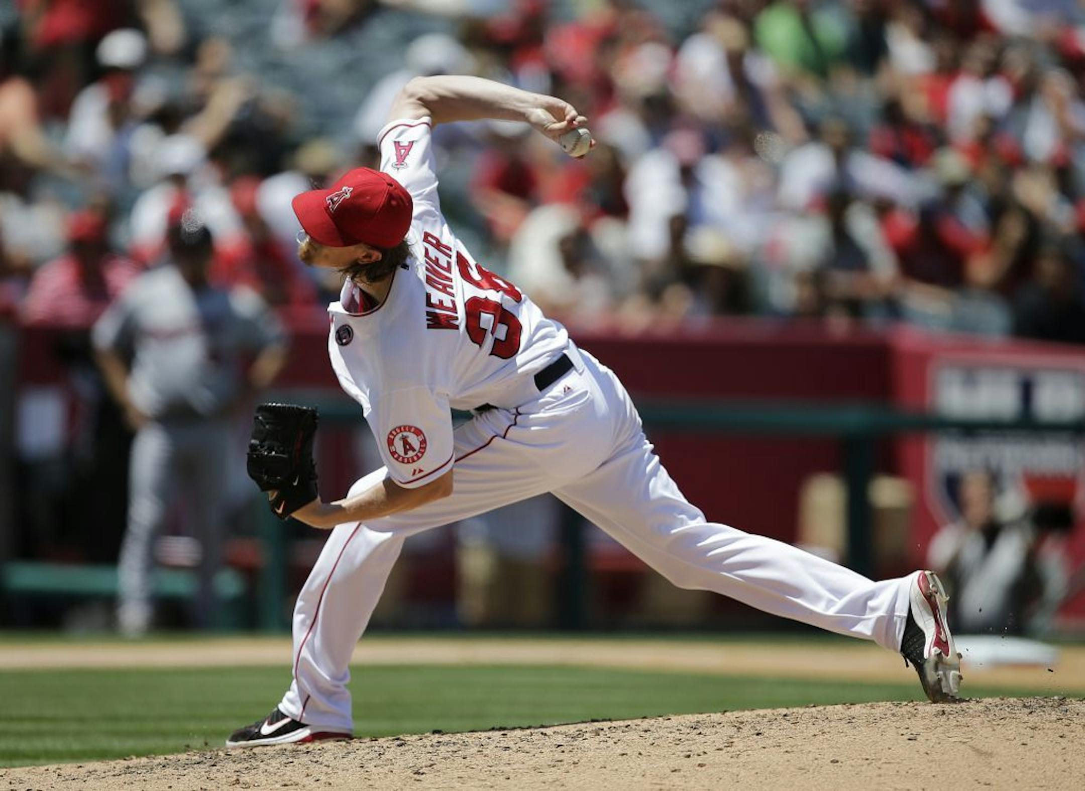 Angels starting pitcher Jered Weaver throws during the fourth inning of a baseball game against the Minnesota Twins on Wednesday, July 24, 2013, in Anaheim, Calif.