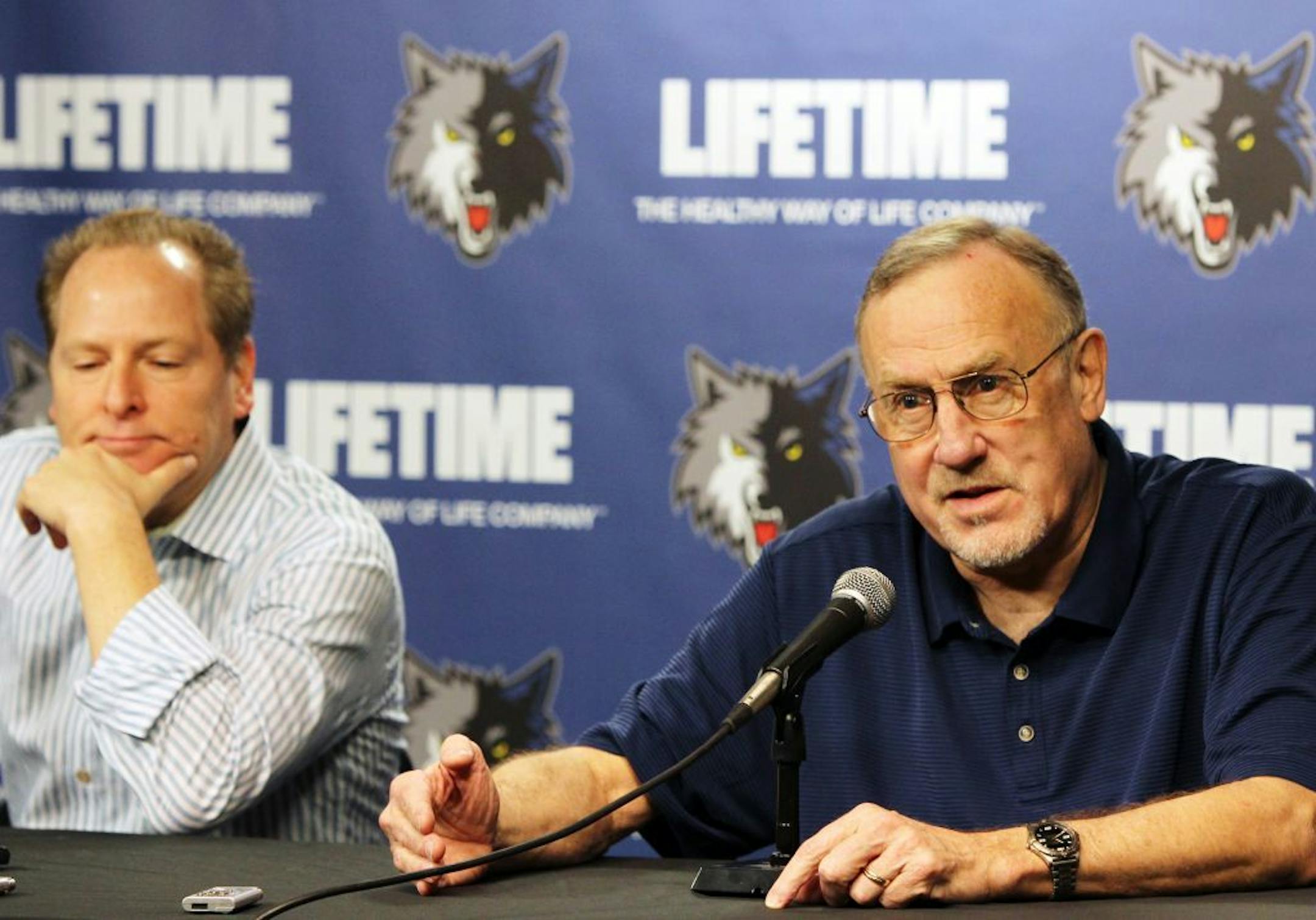Minnesota Timberwolves head coach Rick Adelman, right, along with president of basketball operations David Kahn, left, speak to the media during a season-ending press conference at Target Center in Minneapolis, Friday, April 27, 2012.