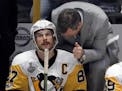 Penguins coach Mike Sullivan, right, talks with center Sidney Crosby during the Stanley Cup.
