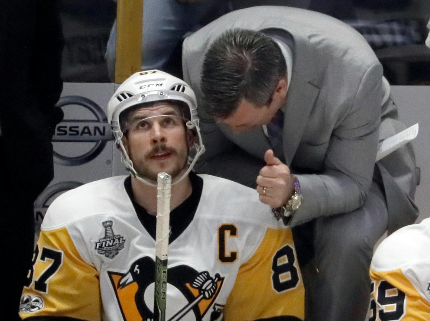 Penguins coach Mike Sullivan, right, talks with center Sidney Crosby during the Stanley Cup.