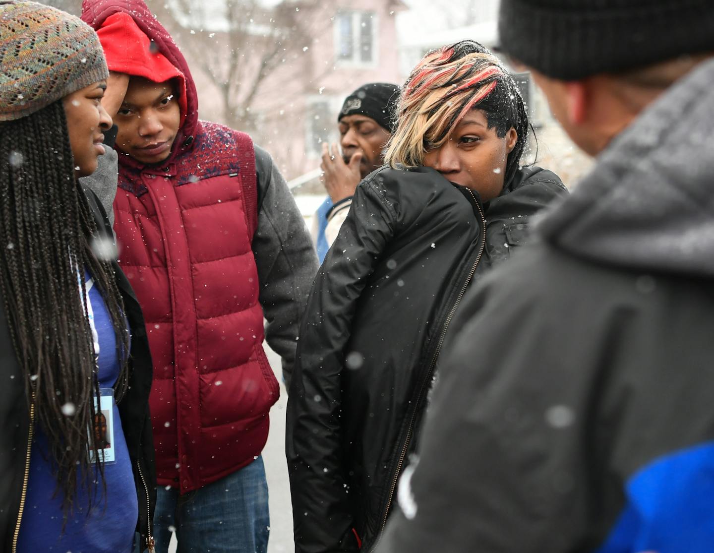 Nicole Shelton, center, told of narrowly escaping the smoke from the fire. She lived on the second floor of the duplex. The Fire at a St. Paul apartment building Wednesday morning killed one woman and severely burned three others, including a child who is fighting for his life. ] GLEN STUBBE &#x2022; glen.stubbe@startribune.com Wednesday January 25, 2017 Fire at a St. Paul apartment building Wednesday morning killed one woman and severely burned three others, including a child who is fighting fo