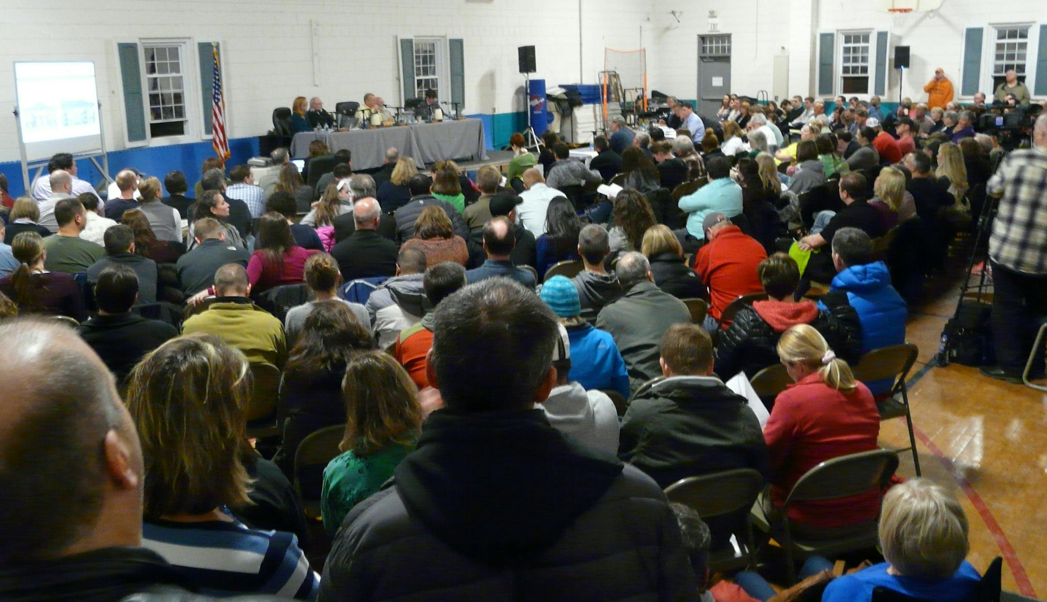 The Carver City Council, including Mayor Mike Webb (in tie), took public testimony in a packed downtown gymnasium on March 2, 2015.