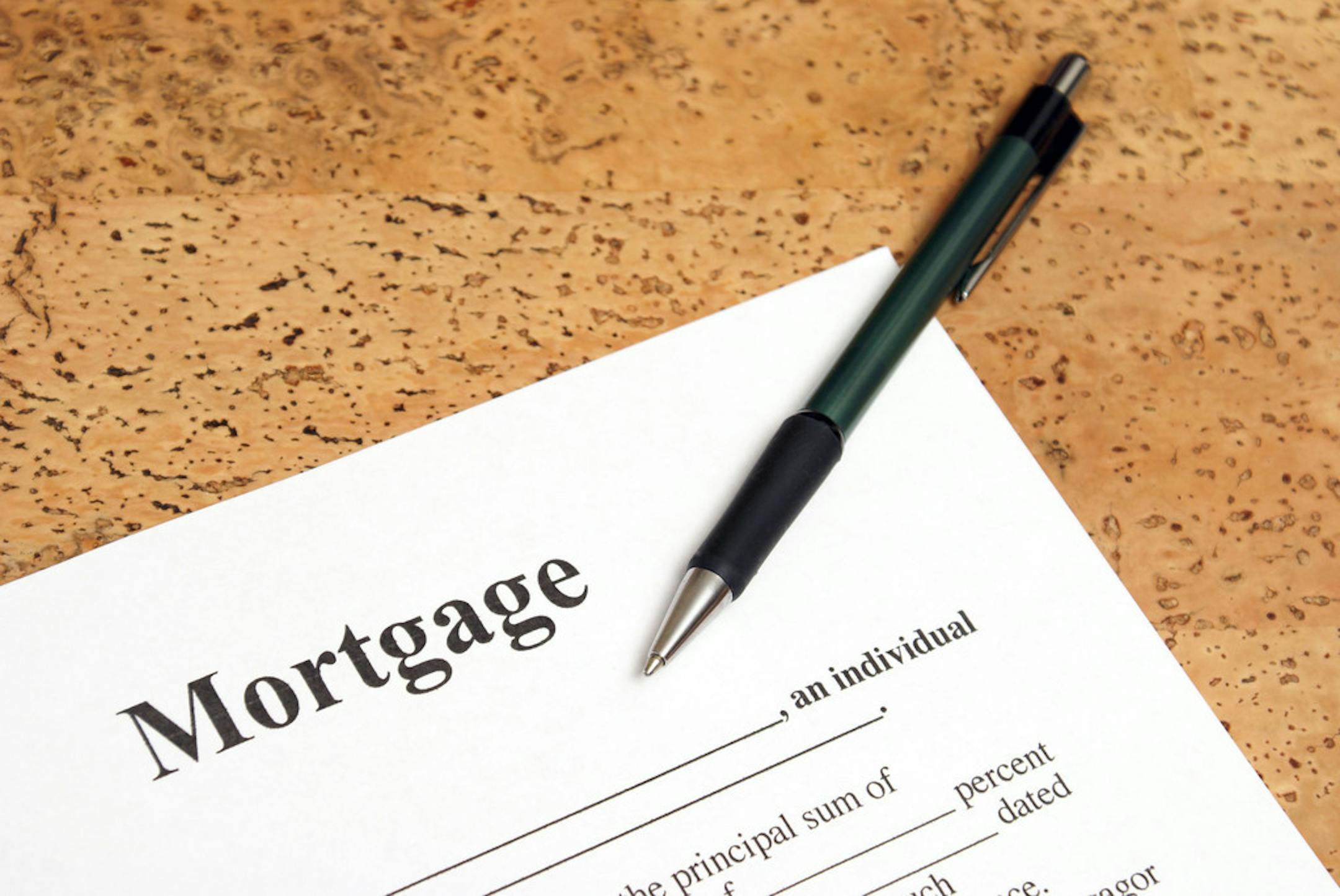 The federal regulator who oversees mortgage giants Fannie Mae and Freddie Mac has compromised on a widely pilloried fee on mortgage refinances, but he's not backing down.