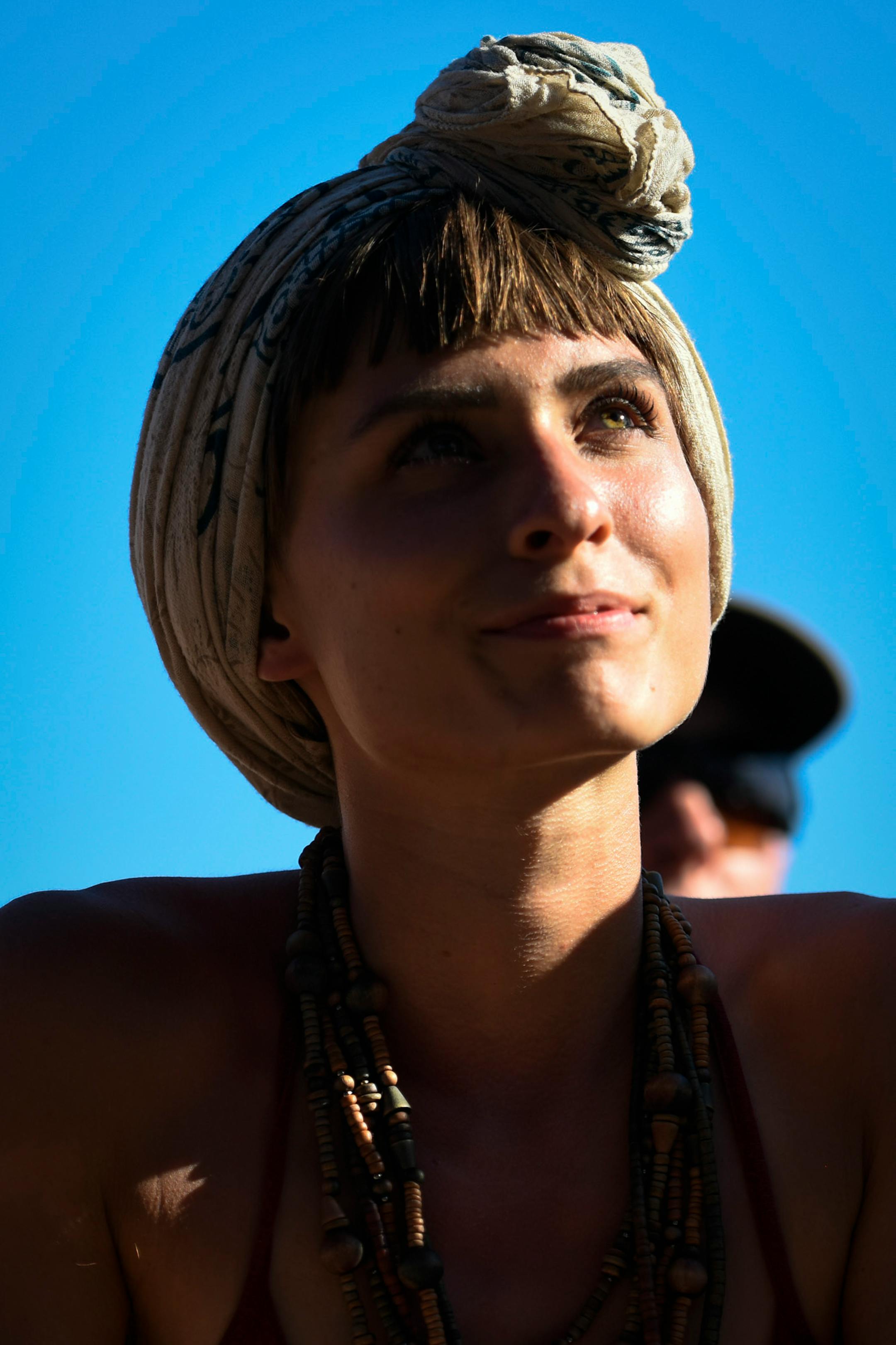 Celeni, of Richmond, Virginia, listened as Moses Sumney performed Saturday on the Lake Eaux Lune stage. ] AARON LAVINSKY ï aaron.lavinsky@startribune.com Day two of the Eaux Claires Music & Art Festival was held Saturday, July 7, 2018 at Foster Farms in Eau Claire, Wisc.